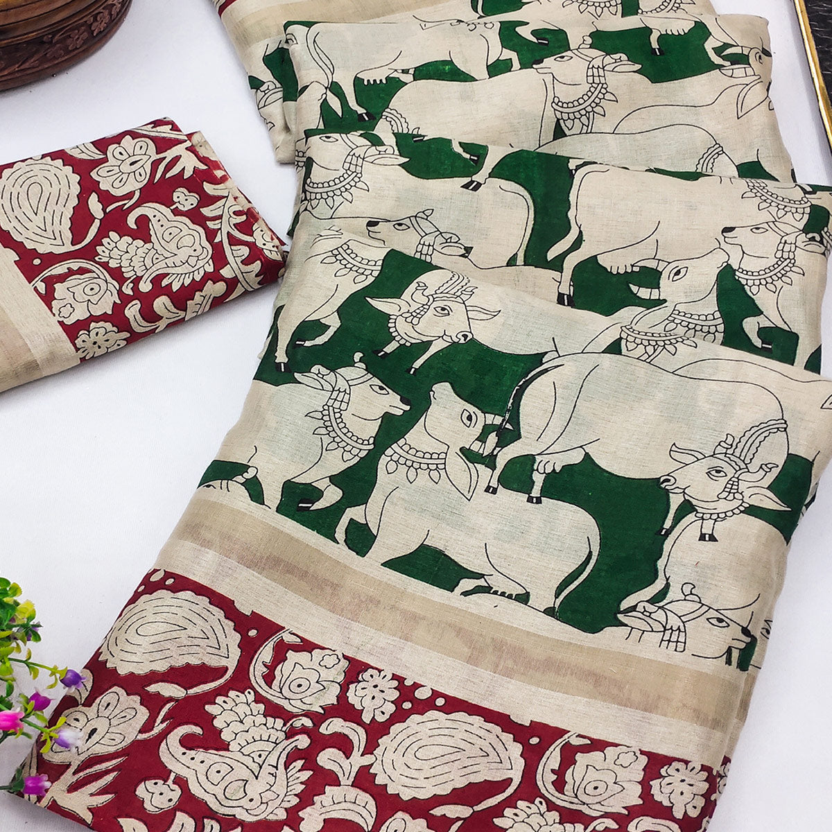 Green & Maroon Cotton Blend Saree Featuring Artistic Animal And Floral Print Fusion