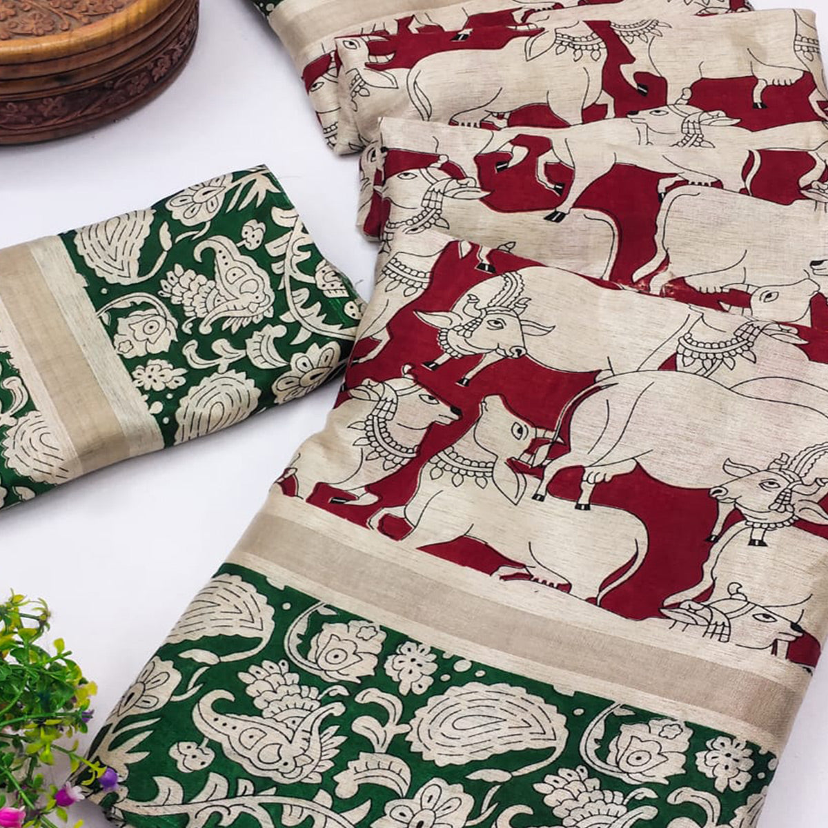 Red & Green Cotton Blend Saree Featuring Artistic Animal And Floral Print Fusion