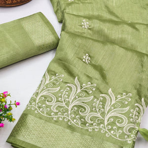 Green Art Silk Saree Adorned With Delicate Floral Embroidery & Stylish Tassel Pallu