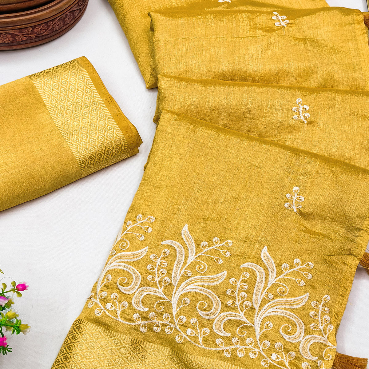 Mustard Art Silk Saree Adorned With Delicate Floral Embroidery & Stylish Tassel Pallu