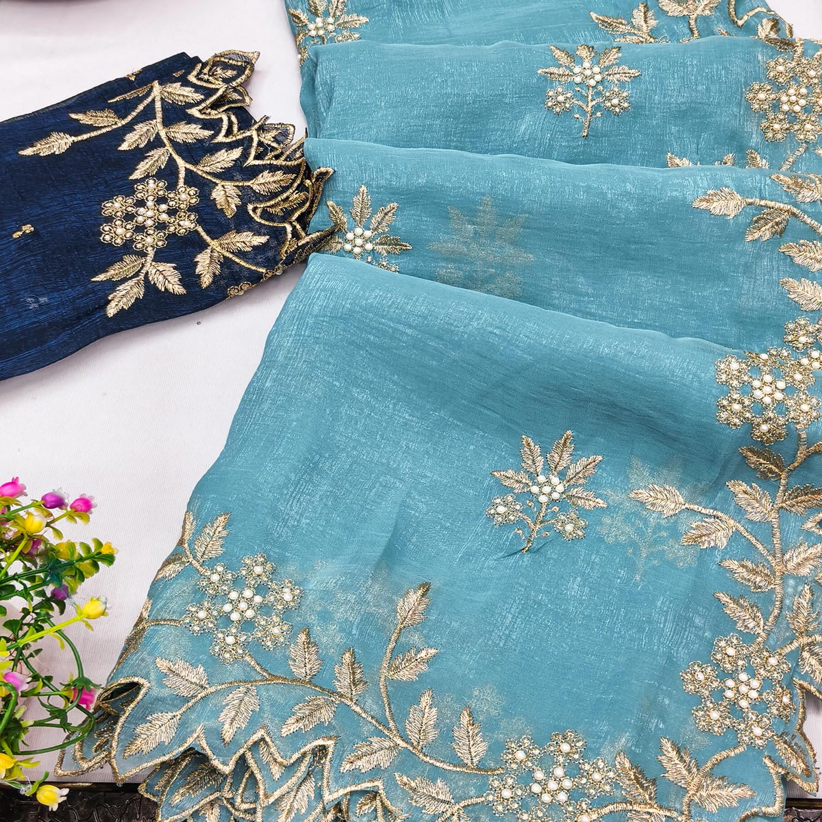 Regal Sky Blue Chiffon Saree Adorned with Intricate Golden Embroidery
