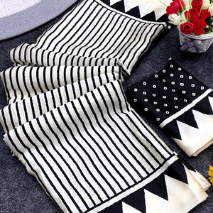 Party Perfect Off White & Black Saree Crafted in Cream Crepe Fabric with Striped Print