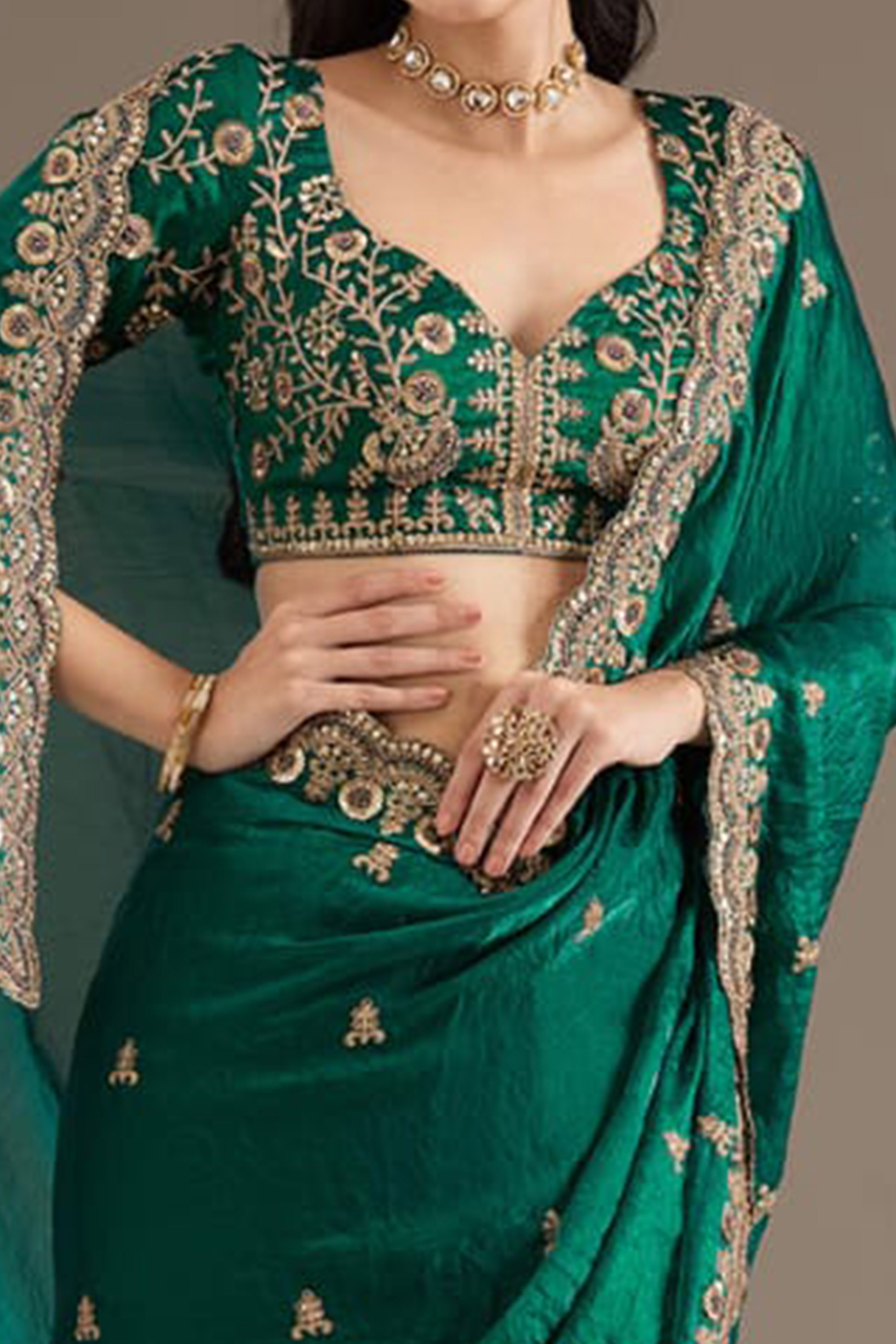 Trendy Green Fancy Satin Saree Enhanced With Rich Golden Embroidered Design