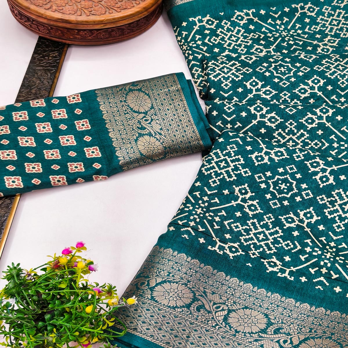Contemporary Teal Geometric Mill Printed Dola Silk Saree With Ornate Floral Zari Border