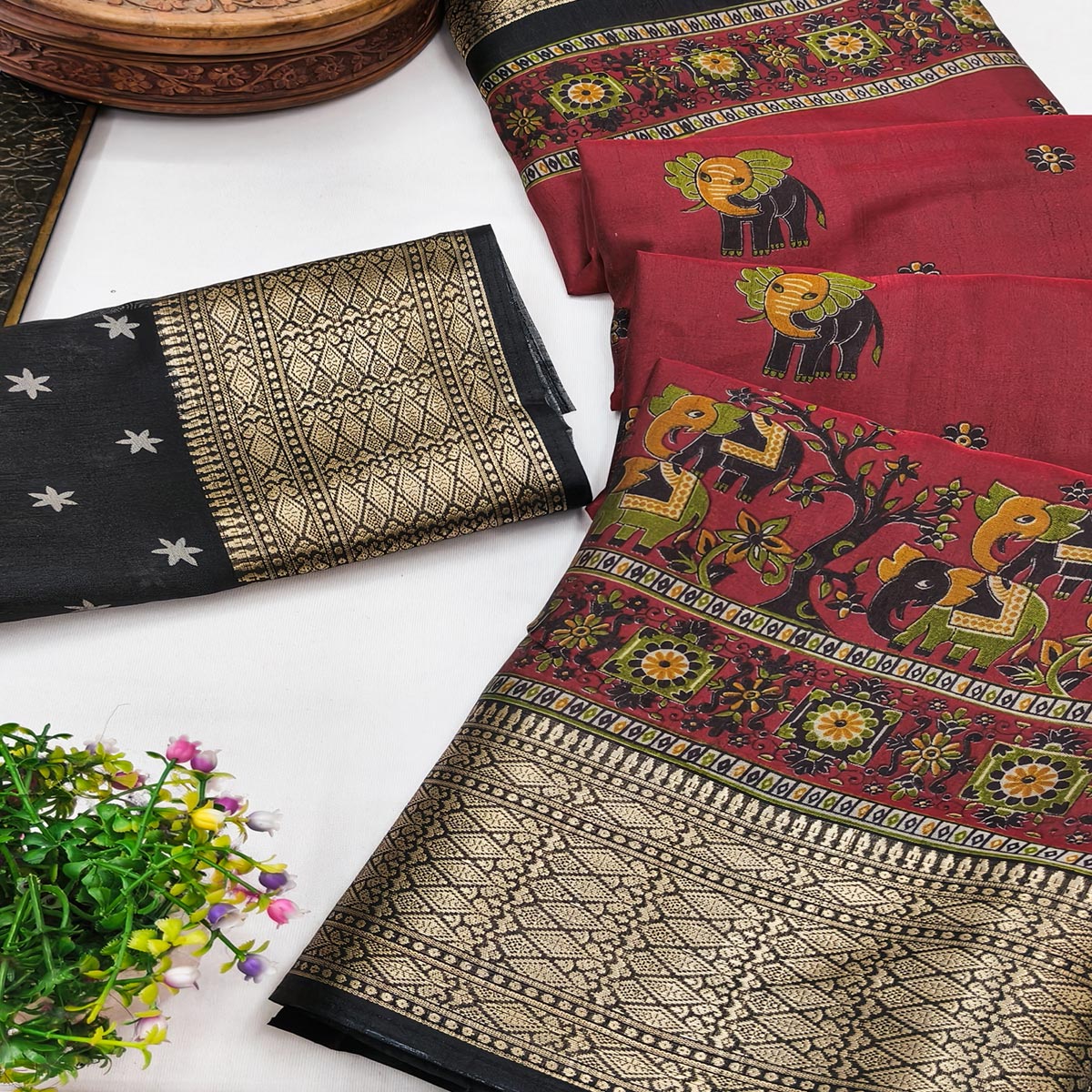 Majestic Maroon Elephant & Floral Printed Dola Silk Saree Featuring Intricate Weaving Border