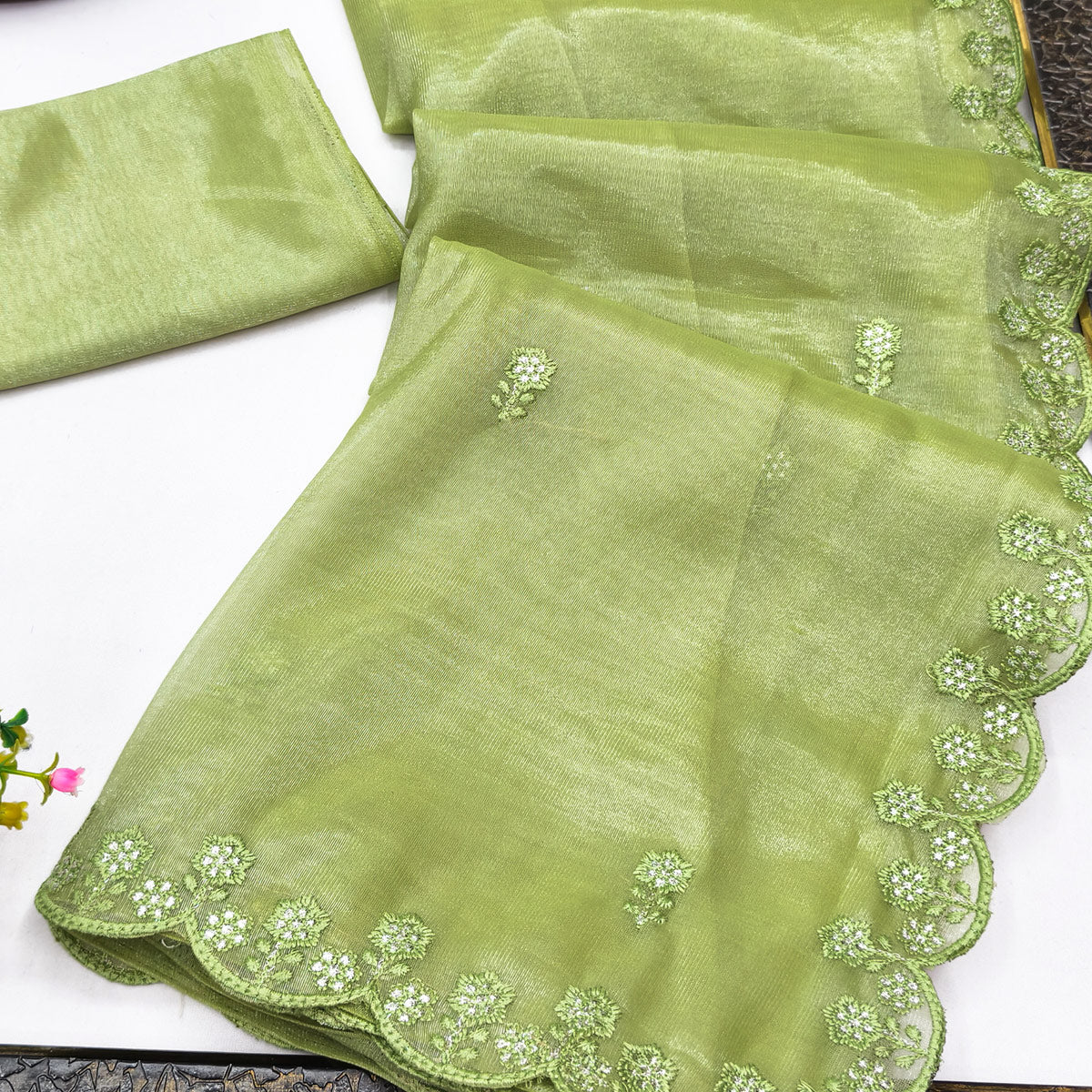Green Net Partywear Saree Featuring Fine Floral Embroidery and a Soft, Flowing Look