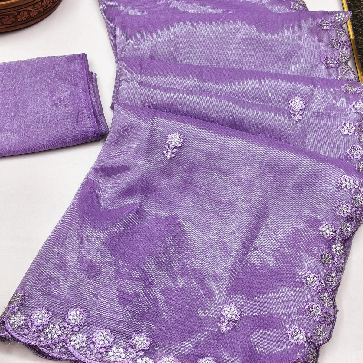 Lavender Net Partywear Saree Featuring Fine Floral Embroidery and a Soft, Flowing Look