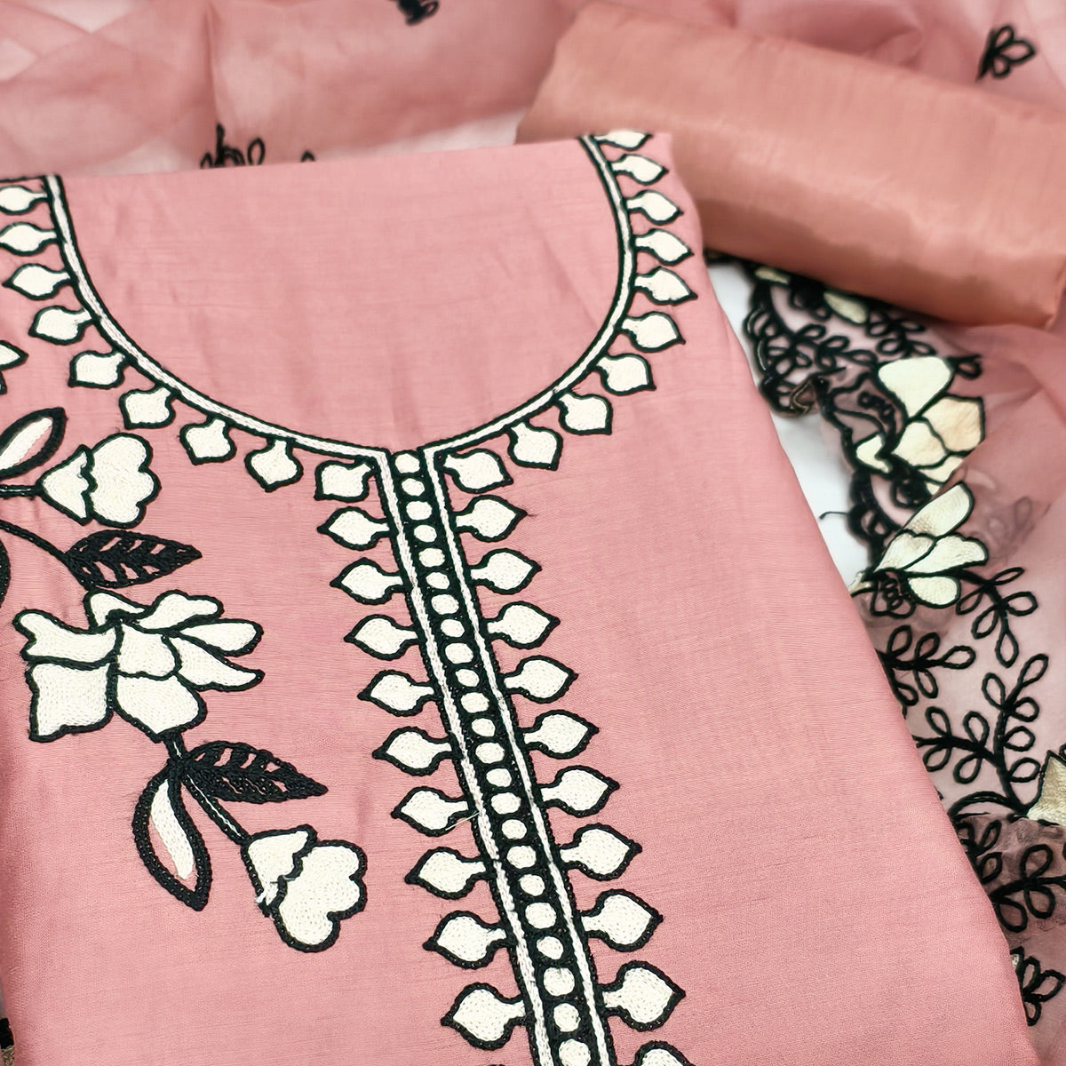 Graceful Peach Floral Viscose Dress Material Enhanced With Intricate Thread Embroidery Work