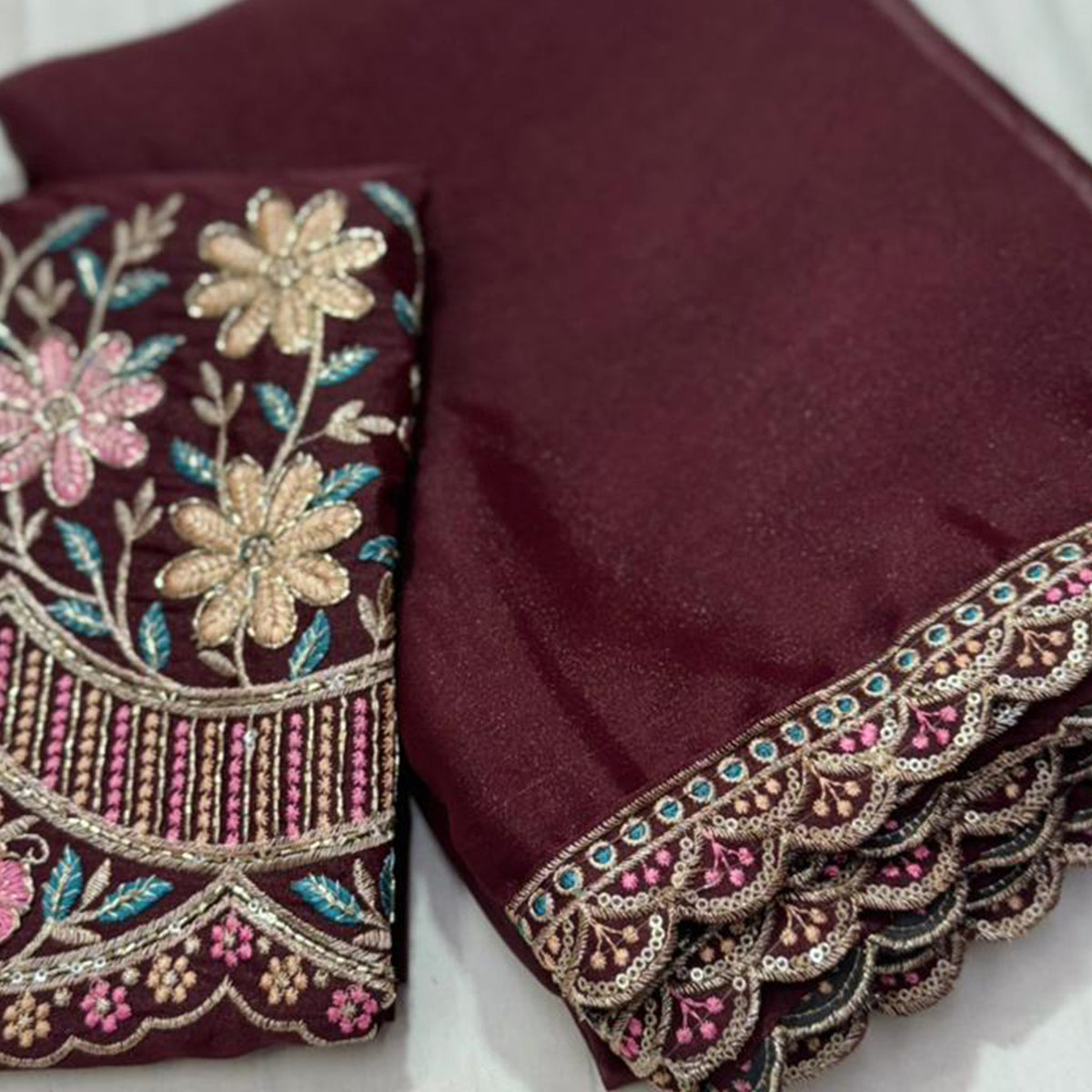Wine Solid Georgette Saree With Embroidered Blouse Piece And Embroidered Border