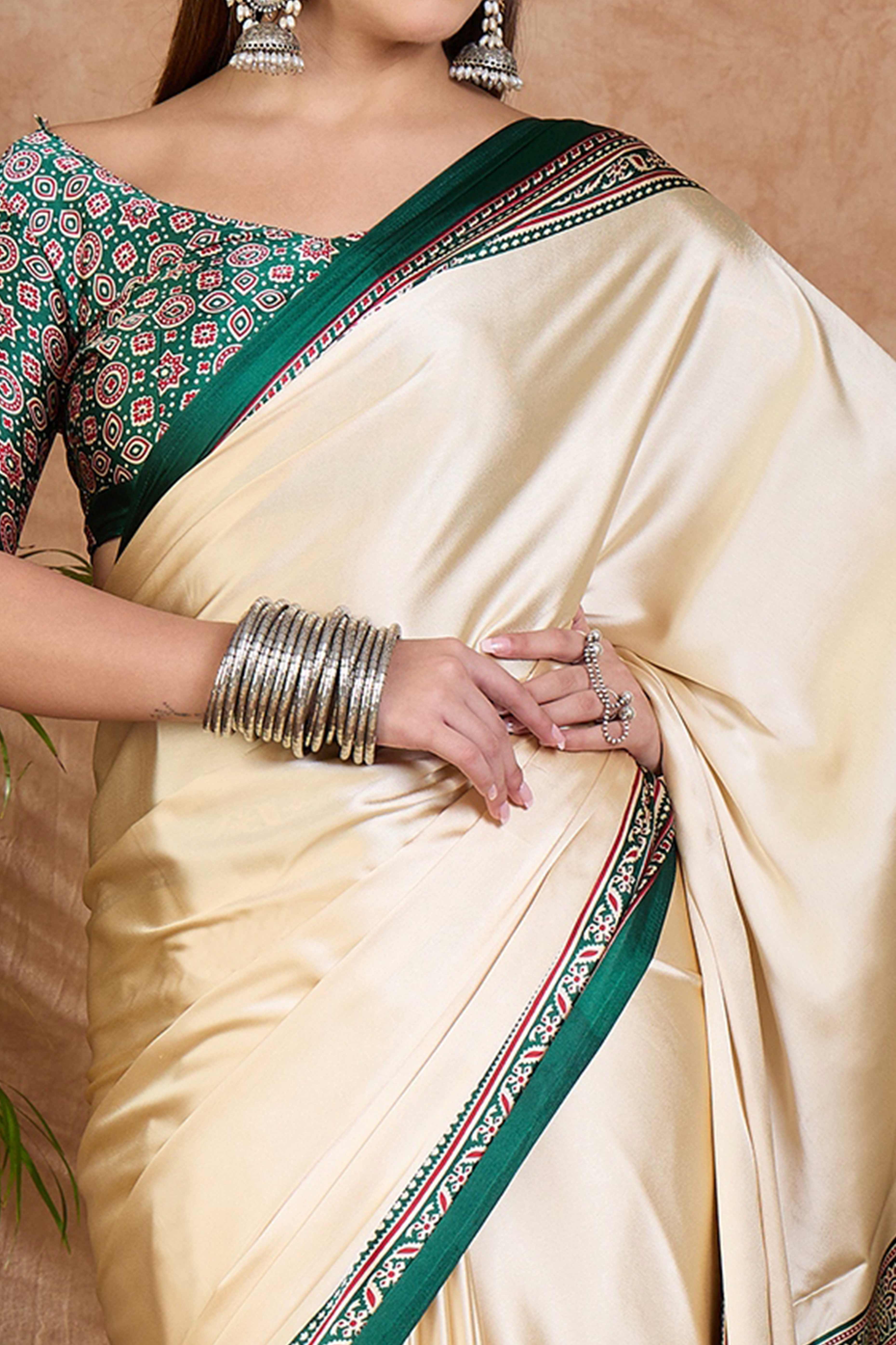 Cream & Green Modal Satin Saree Featuring a Solid Base and Artisanal Ajrakh Pallu
