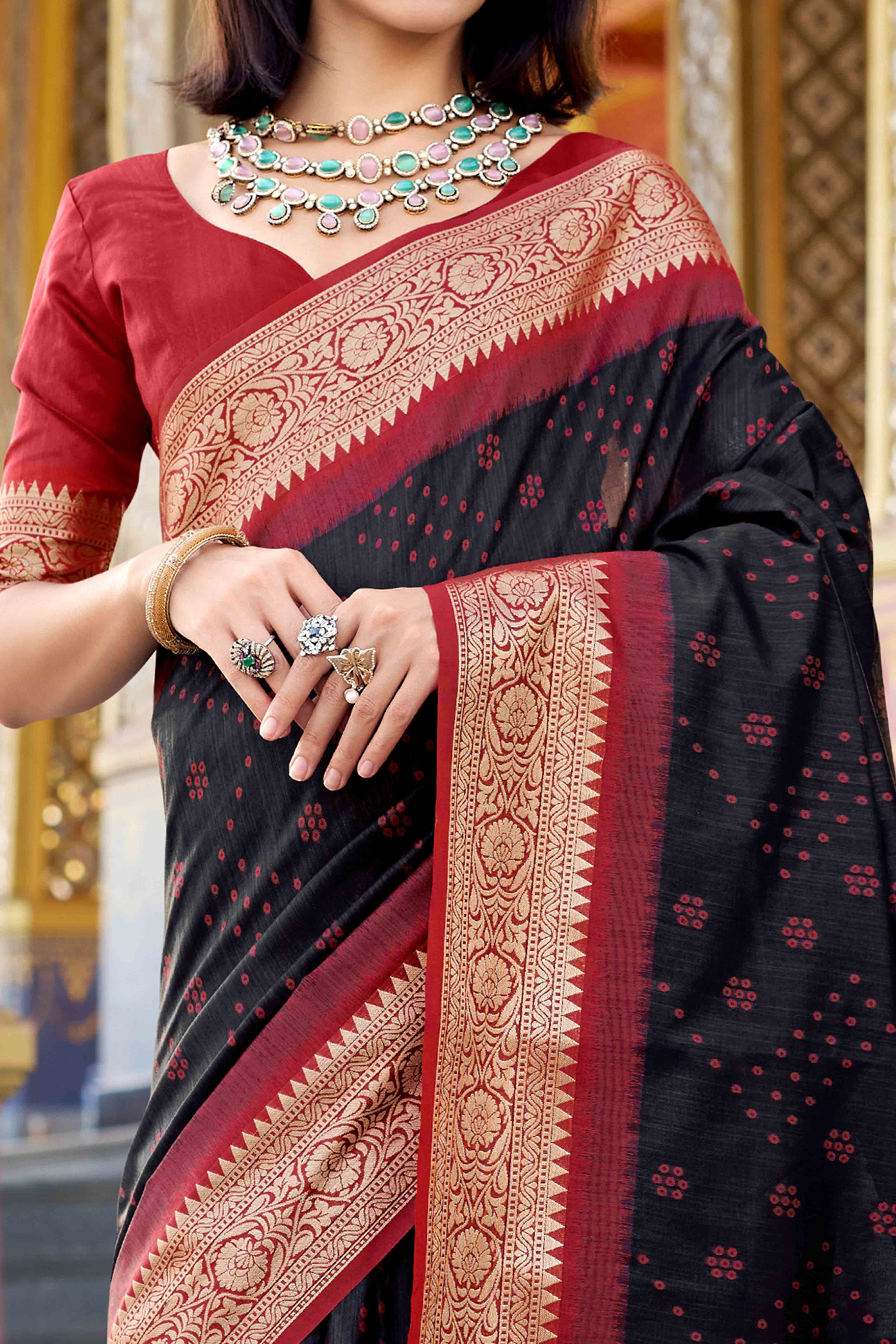 Silk Blend Woven Bandhani Saree In Black With Contrasting Patola Pallu