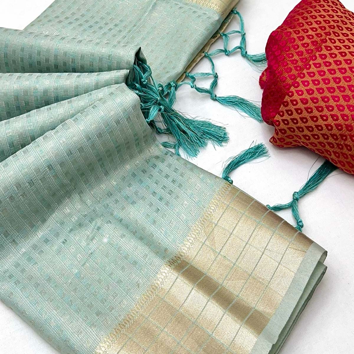 Sky Blue Soft Tissue Saree Featuring Rich Zari-Woven Detailing.