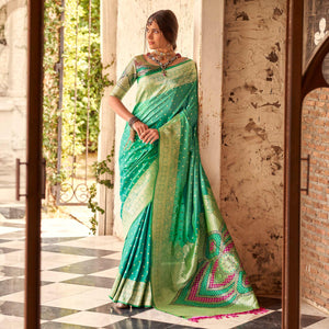 Rama Green Floral Woven Banarasi Silk Saree With Tassels