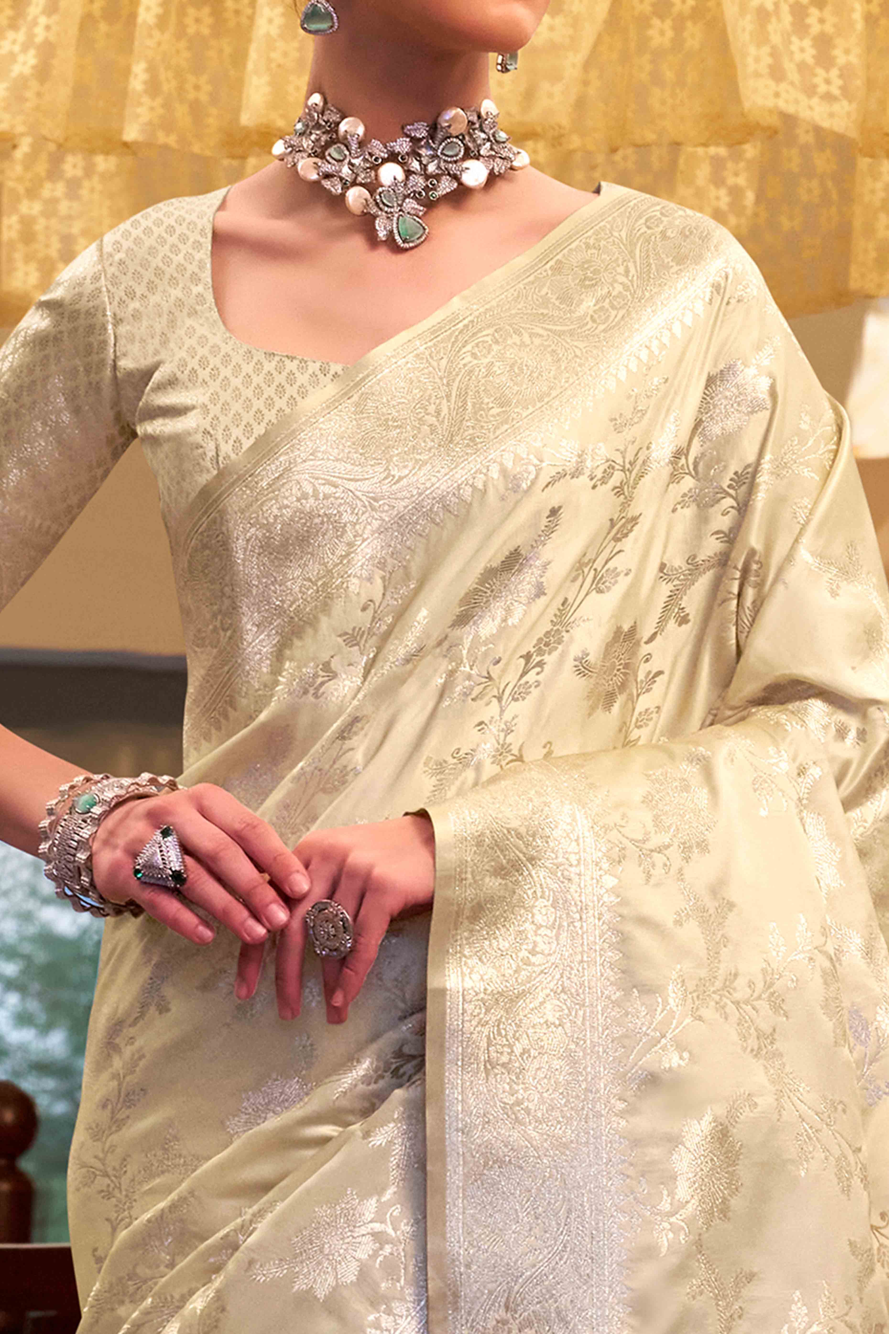 Off White Soft Satin Saree Featuring Exquisite Zari Weaving Work