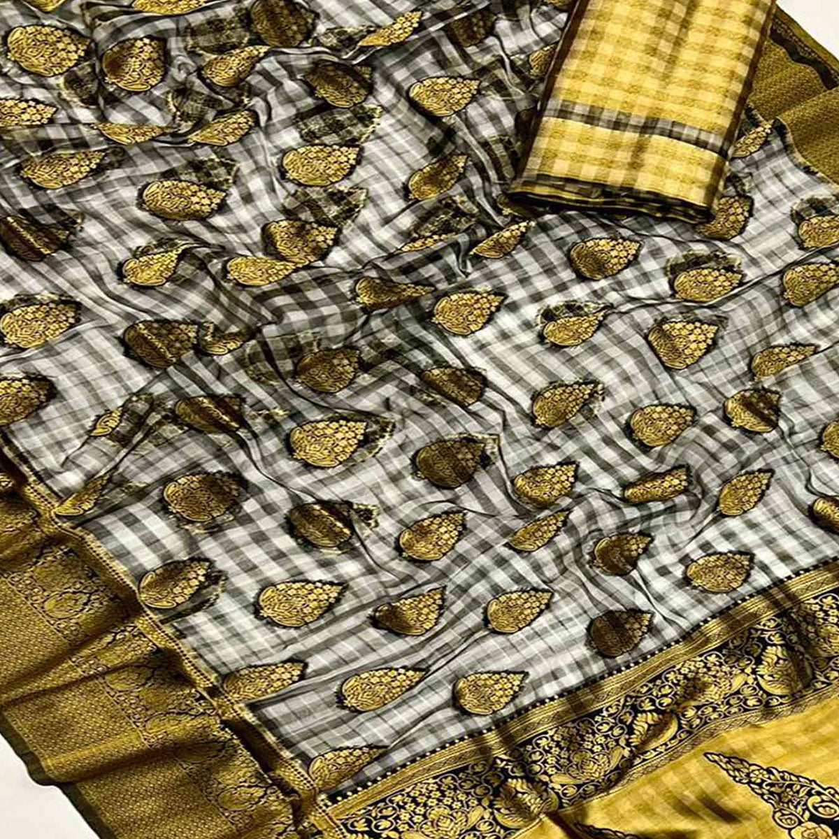 Black Checks Woven Organza Saree With Tassels