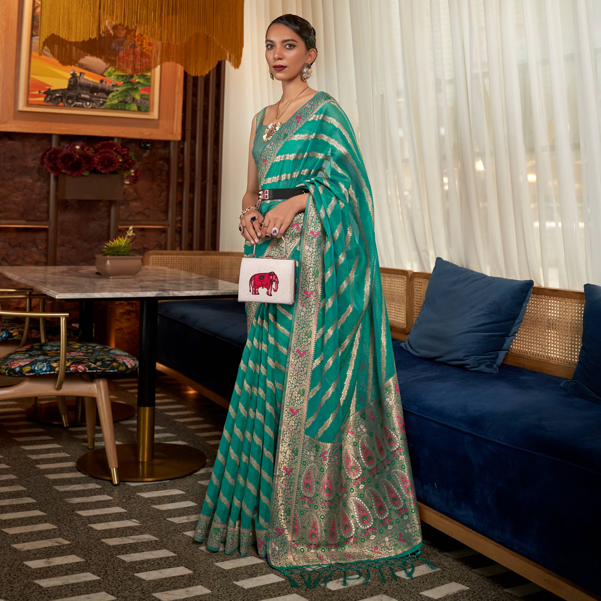 Rama Green Woven Organza Saree With Tassels