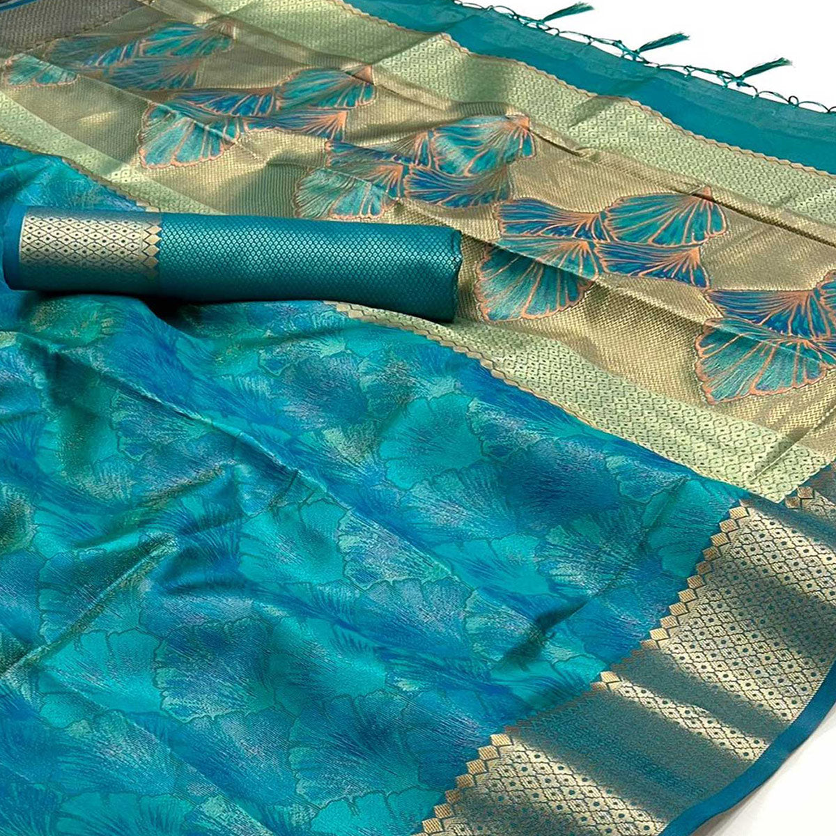 Teal Zari Woven Organza Saree Tassels