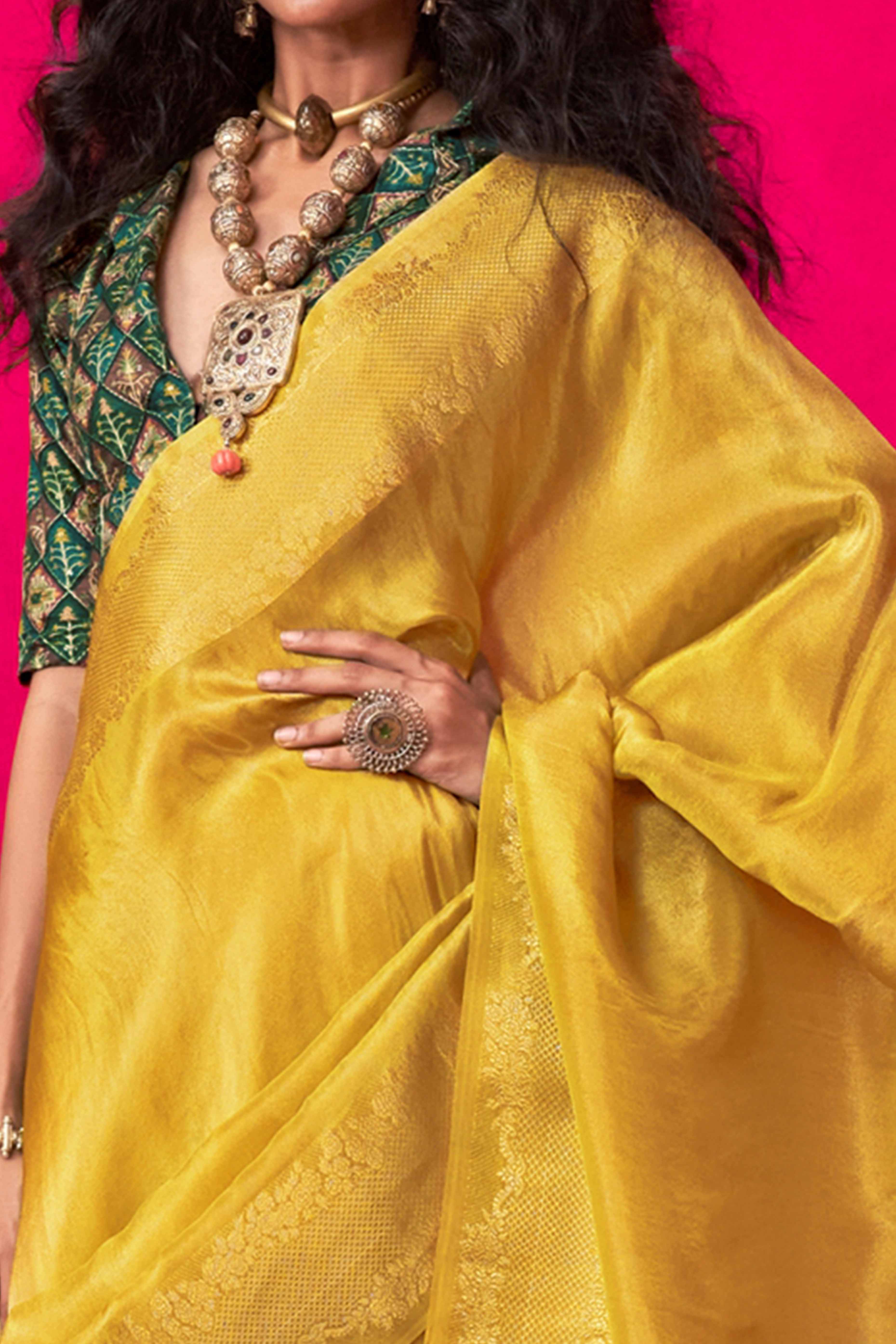 Yellow Tissue Saree Adorned with Zari Weaving Border