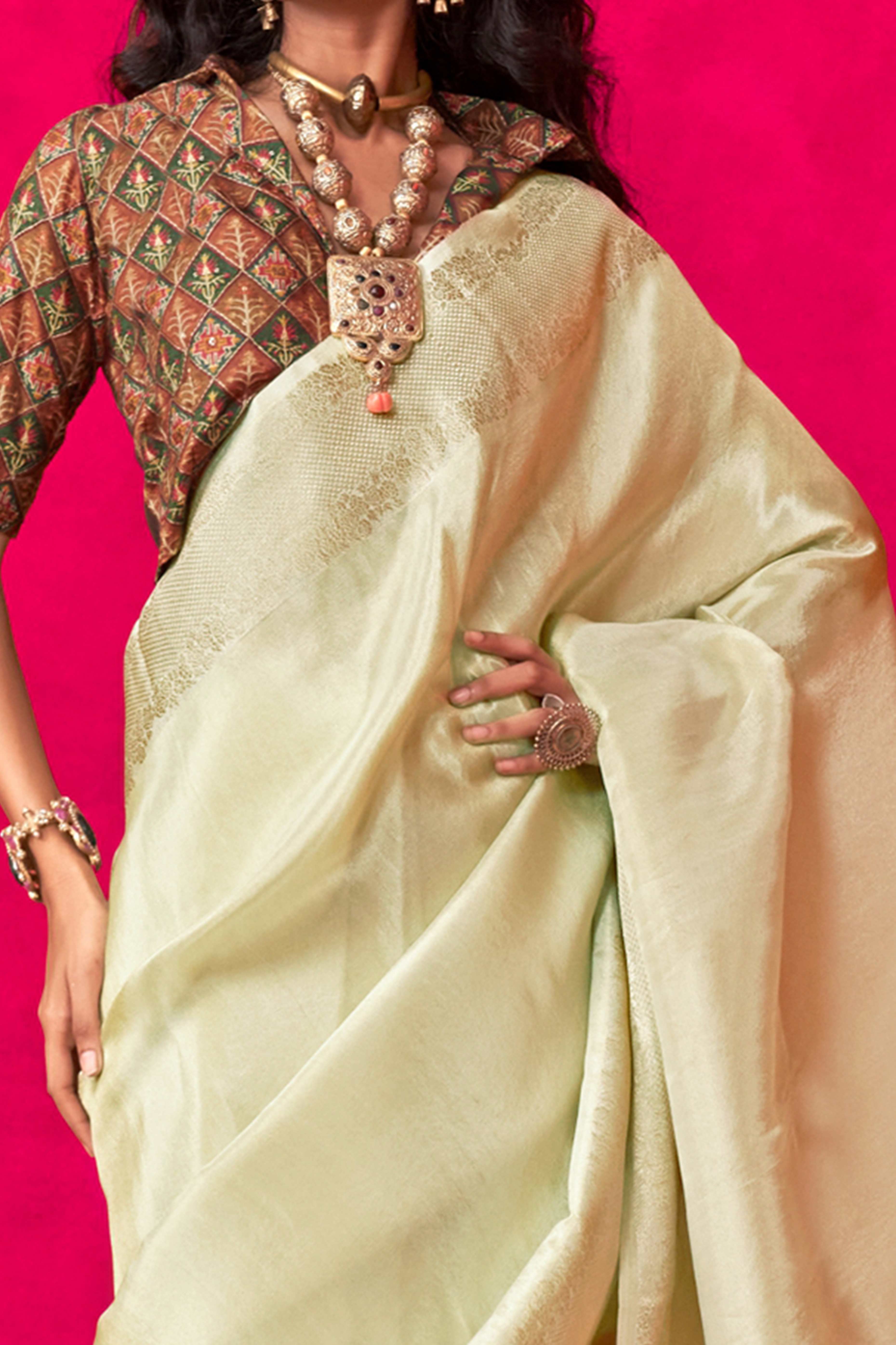 Cream Tissue Saree Adorned with Zari Weaving Border