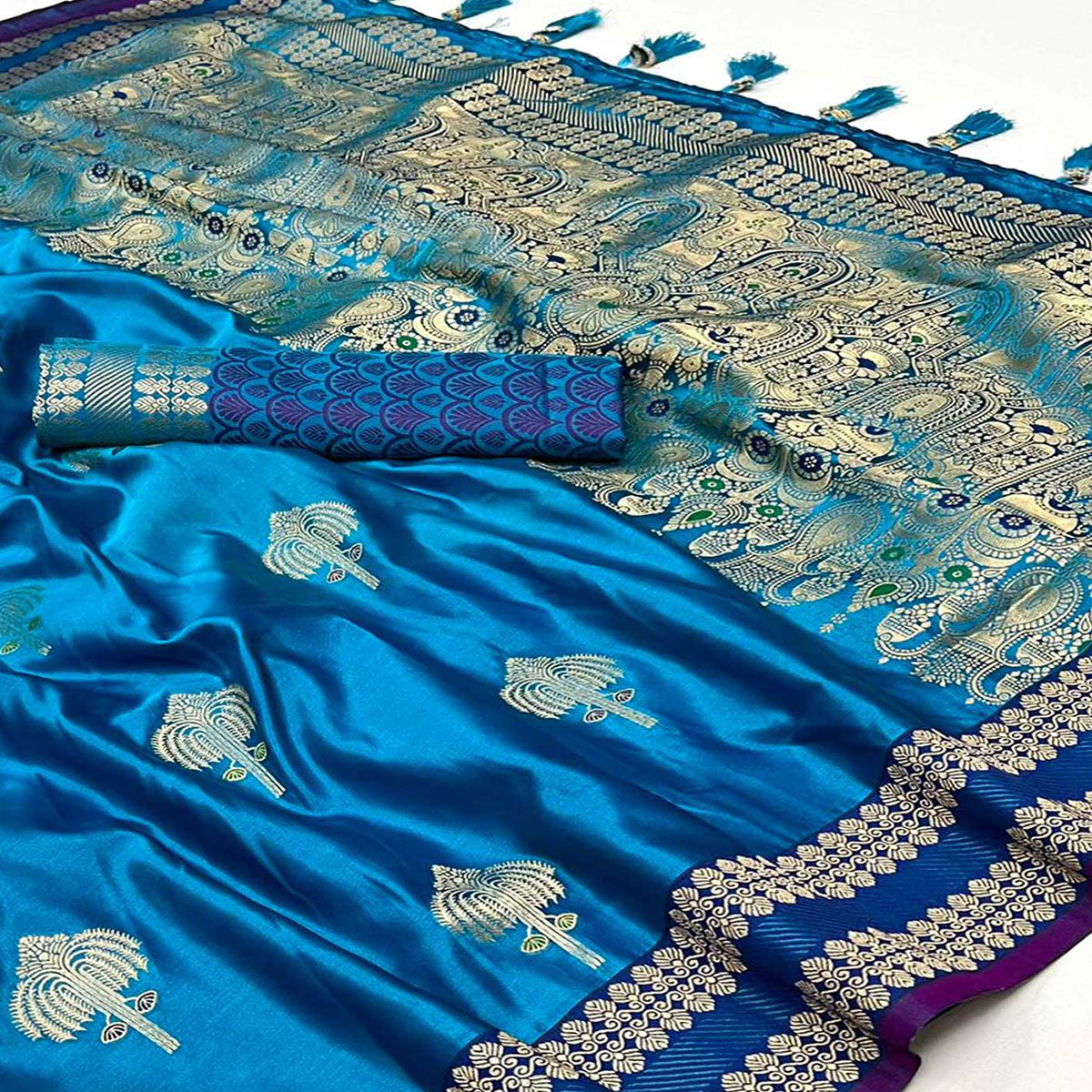 Peacock Blue Woven Satin Saree With Tassels