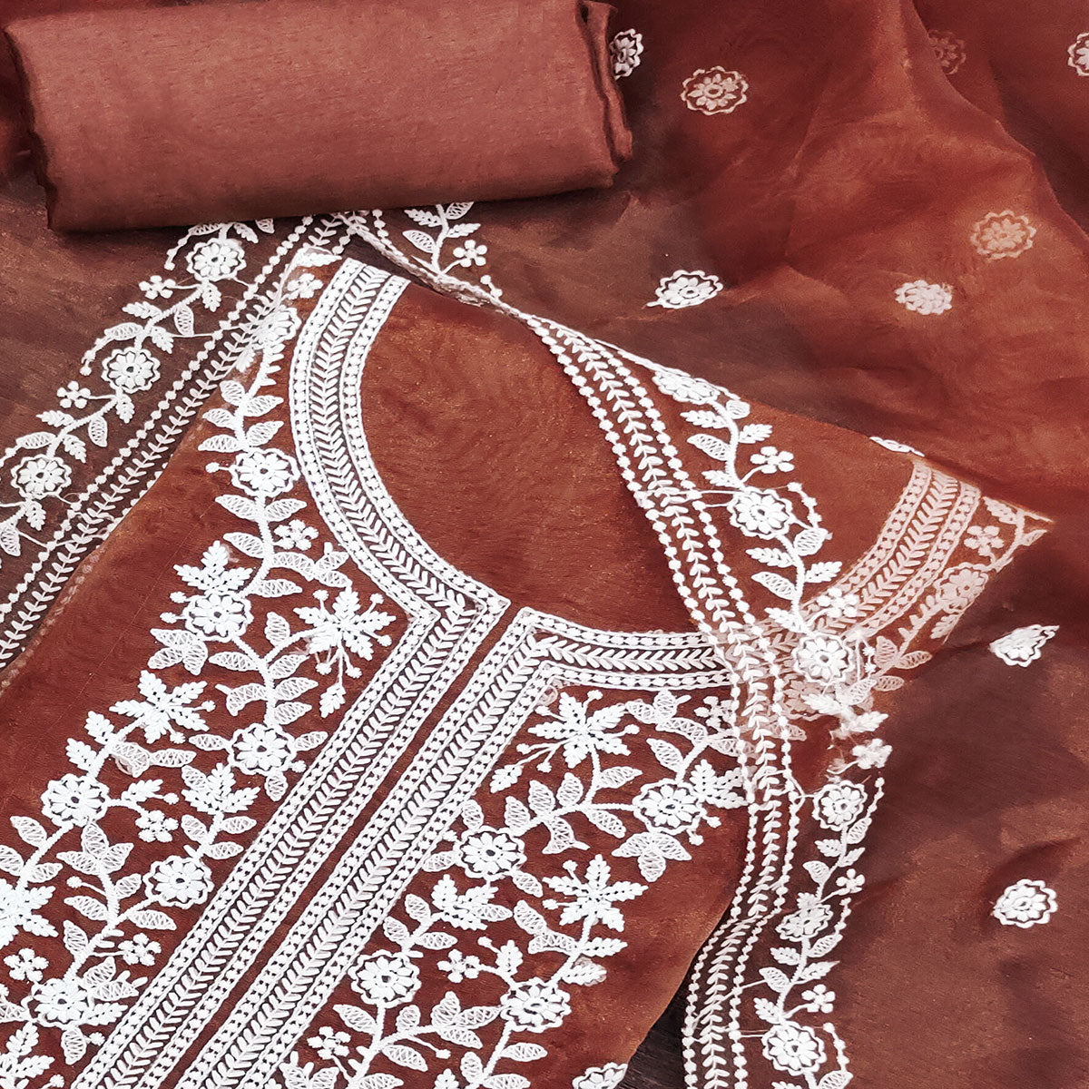 Step into Elegance With This Rust Floral Thread Embroidered Organza Dress Material