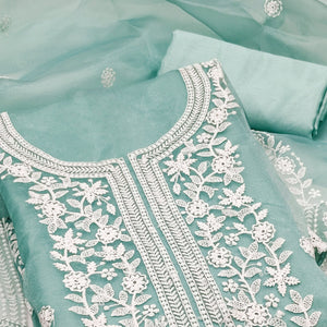 Unleash Your Style With This Turquoise Floral Thread Embroidered Organza Dress Material