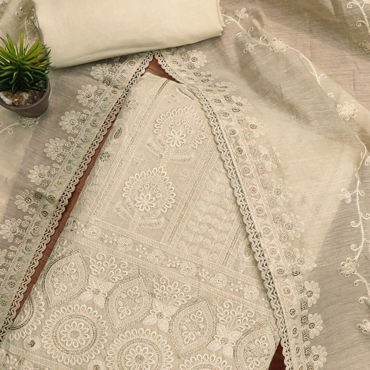 Graceful Cream Chanderi Silk Dress Material Featuring Intricate Lucknowi Embroidery