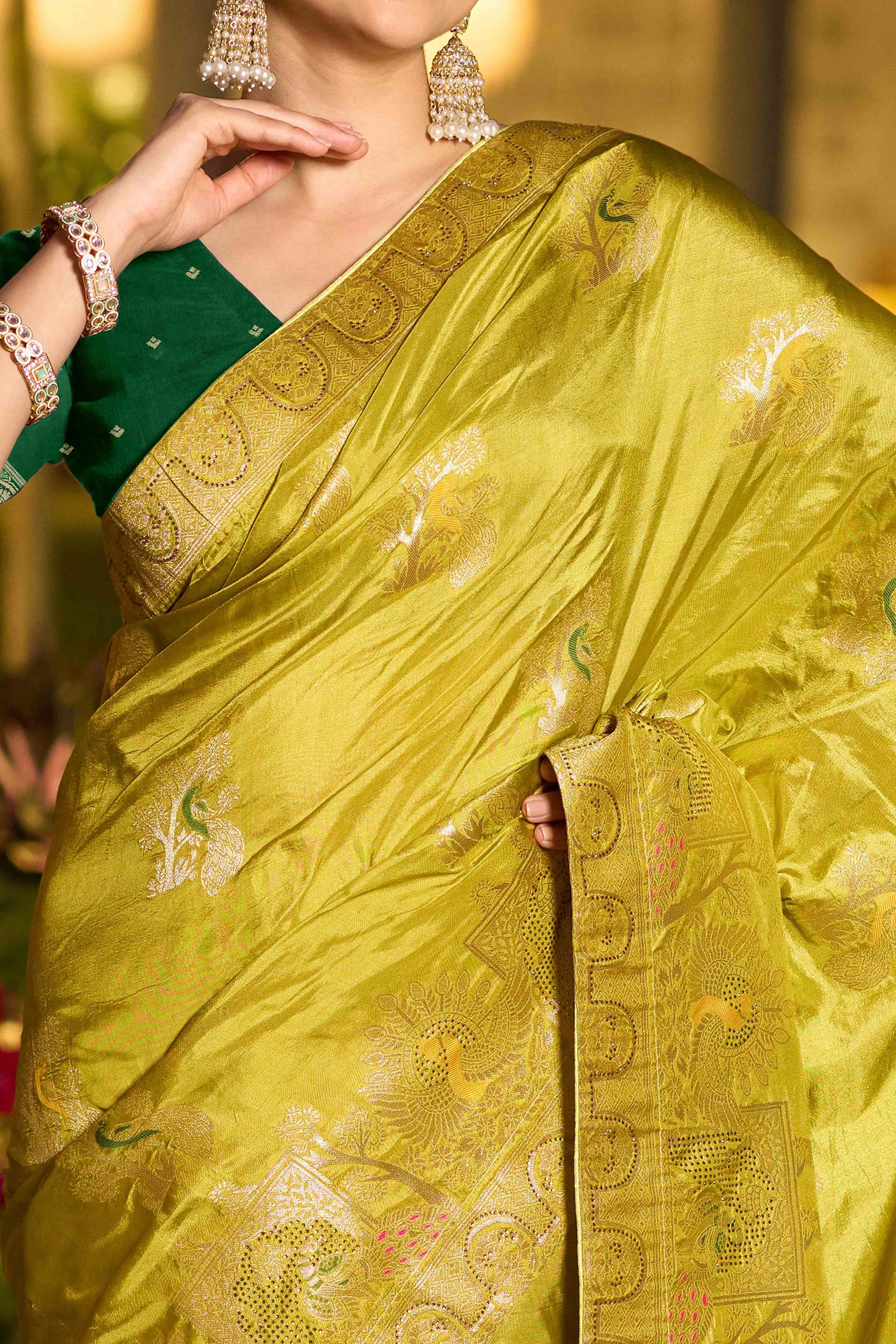 Graceful Green Dola Silk Saree With Intricate Zari Weaving & Sparkling Swarovski Accents