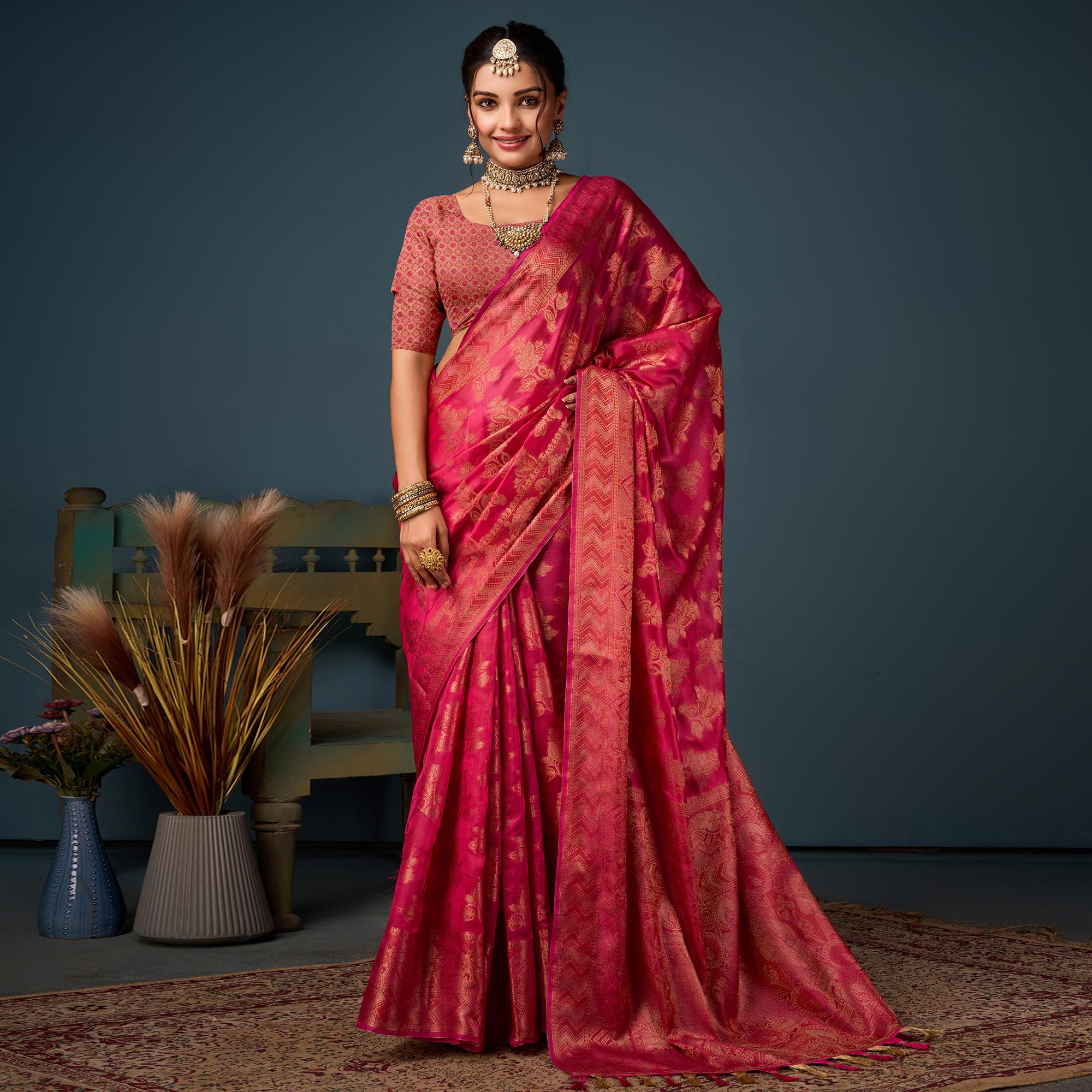 Rani Pink Floral Woven Organza Saree With Tassels