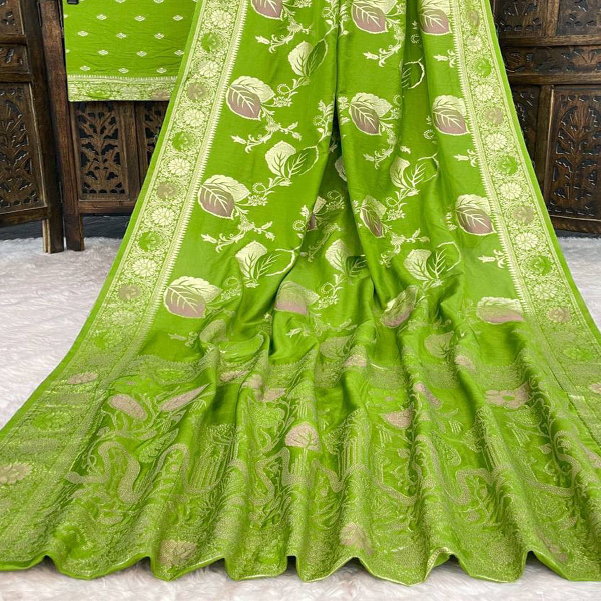 Green Soft Dola Silk Saree Adorned with Intricate Meenakari-Style Weaving