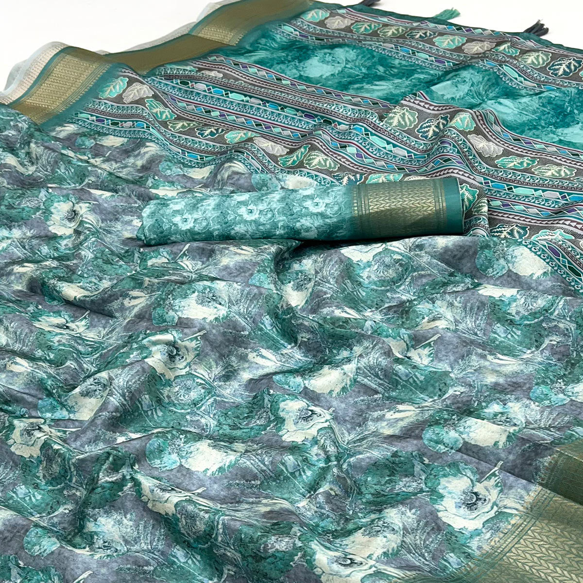 Rama Green Elegance In Dola Saree Featuring Blooming Digital Prints & Zari Border & Tassel Pallu