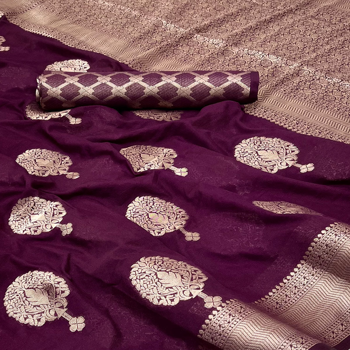 Wine Crepe Silk Saree Featuring Floral Zari Weave & Graceful Tassel Pallu