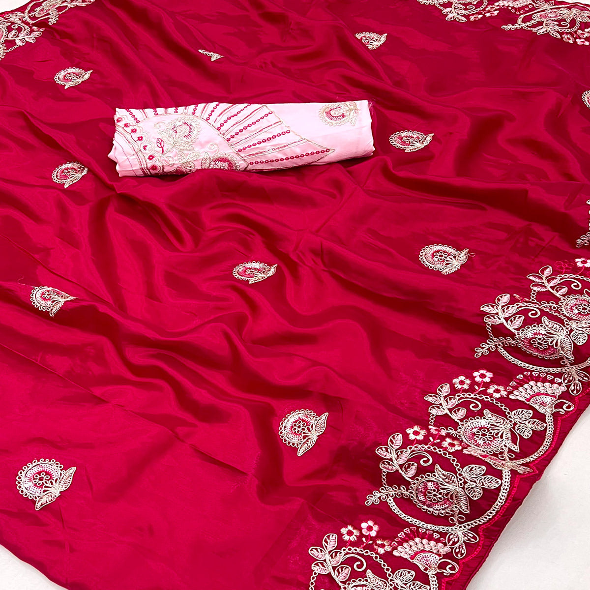 Rani Pink Embroidered Satin Saree with Smooth Texture and Graceful Festive Appeal
