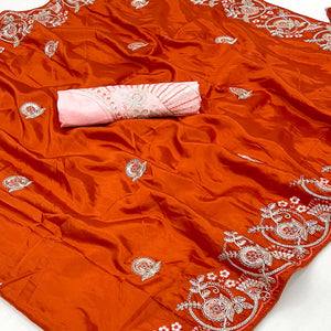 Orange Embroidered Satin Saree with Smooth Texture and Graceful Festive Appeal
