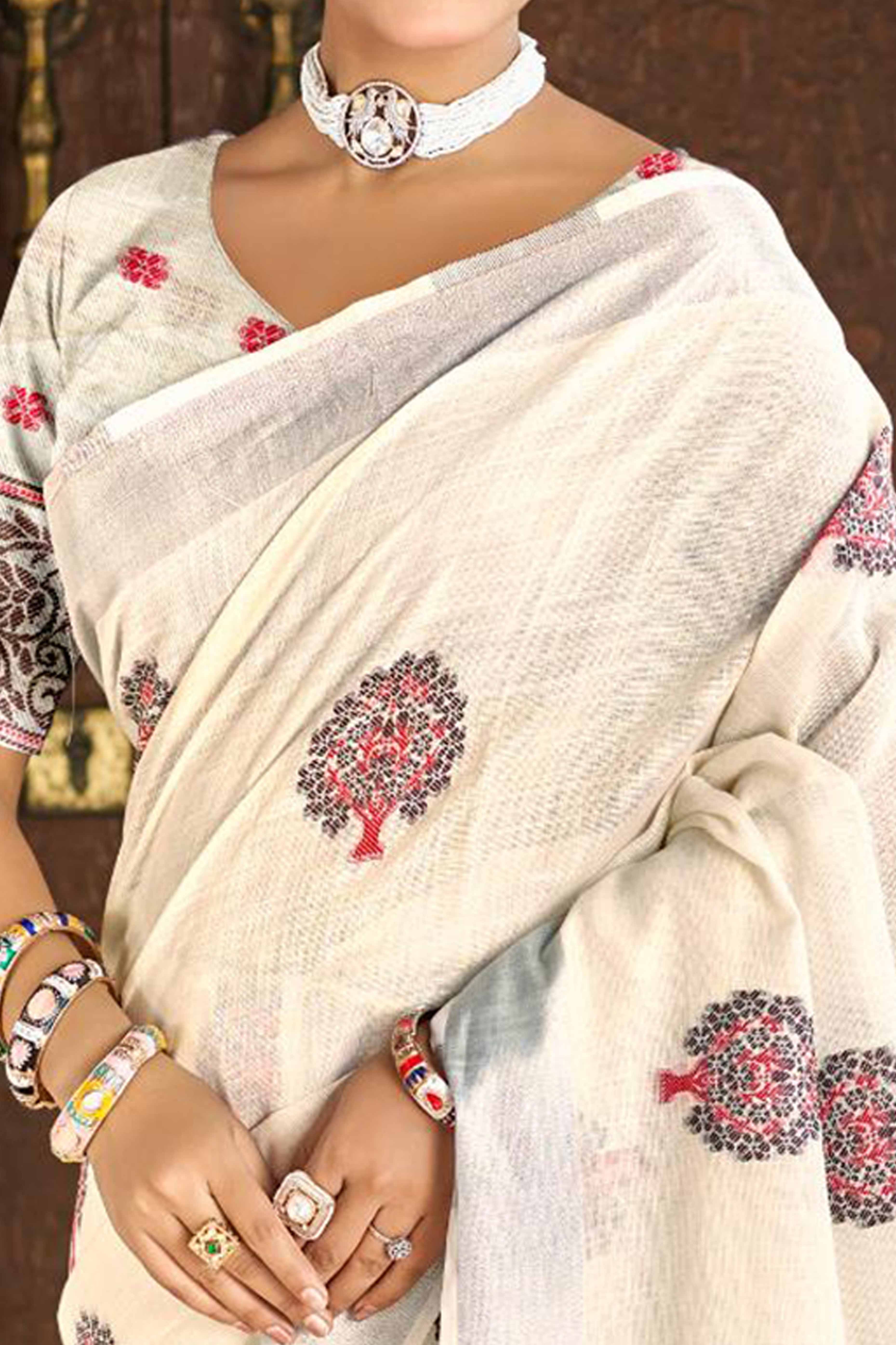 Cream Linen Saree Adorned With Intricate Zari Weaving & Tassel Pallu