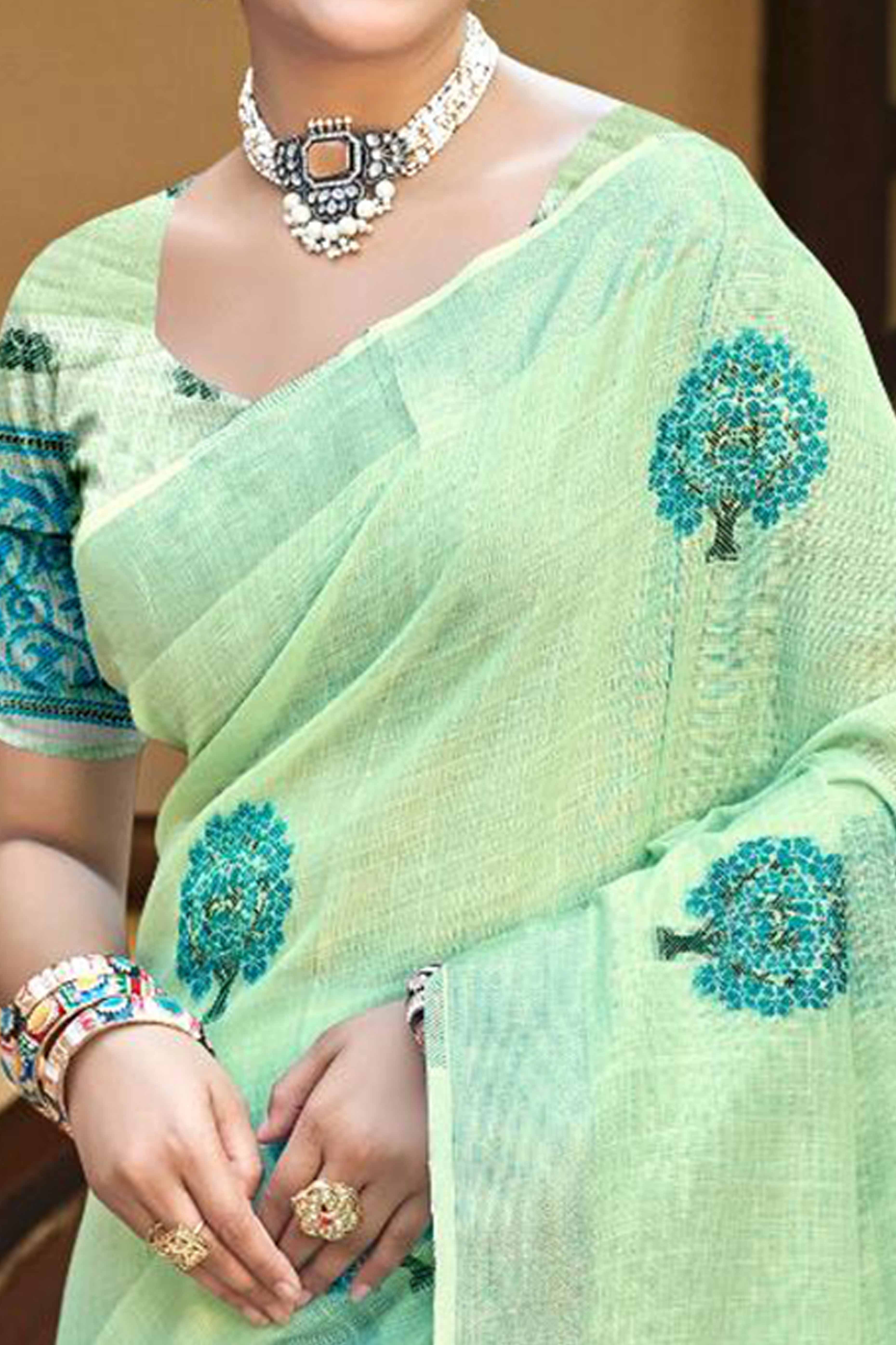 Green Linen Saree Adorned With Intricate Zari Weaving & Tassel Pallu