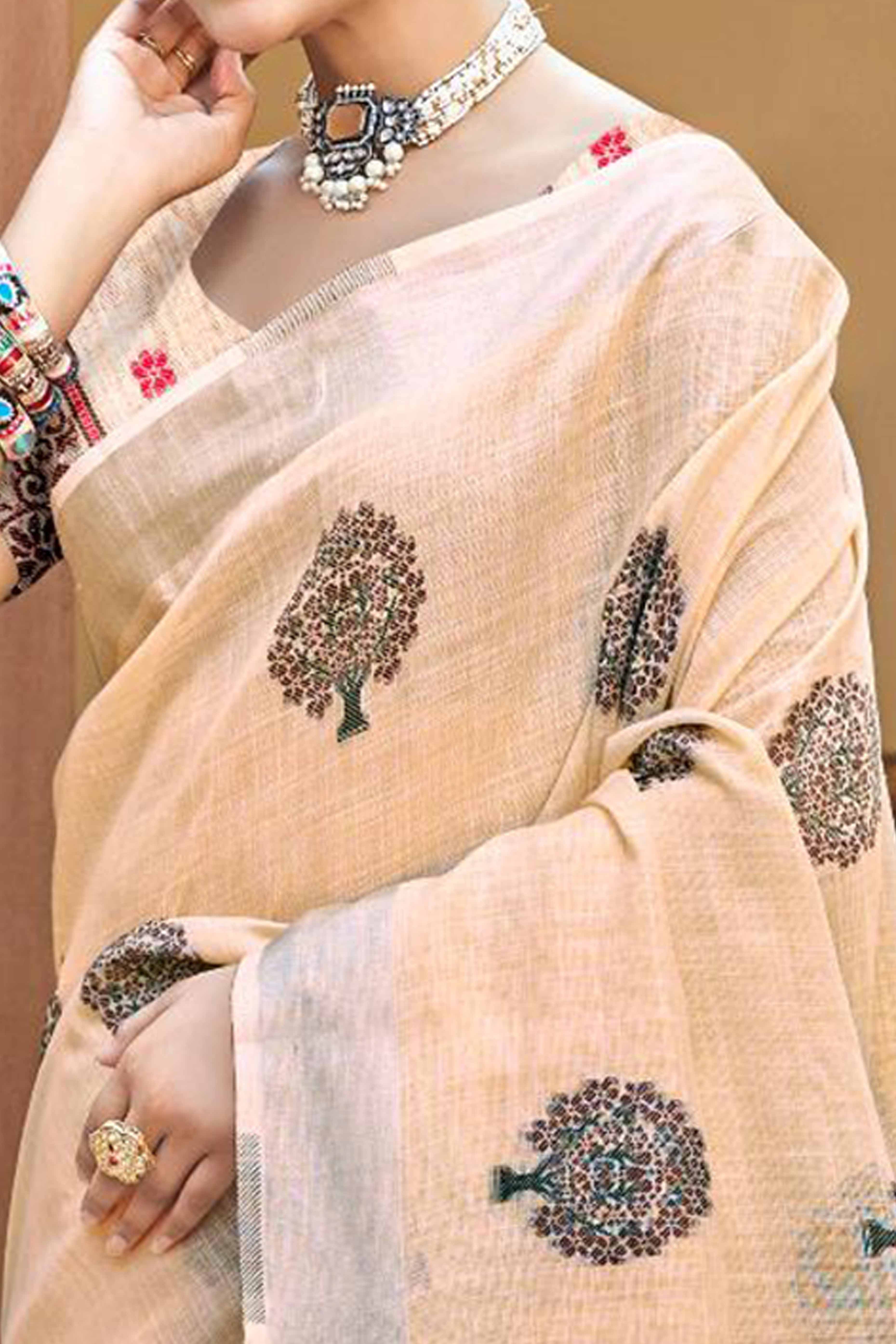 Peach Linen Saree Adorned With Intricate Zari Weaving & Tassel Pallu