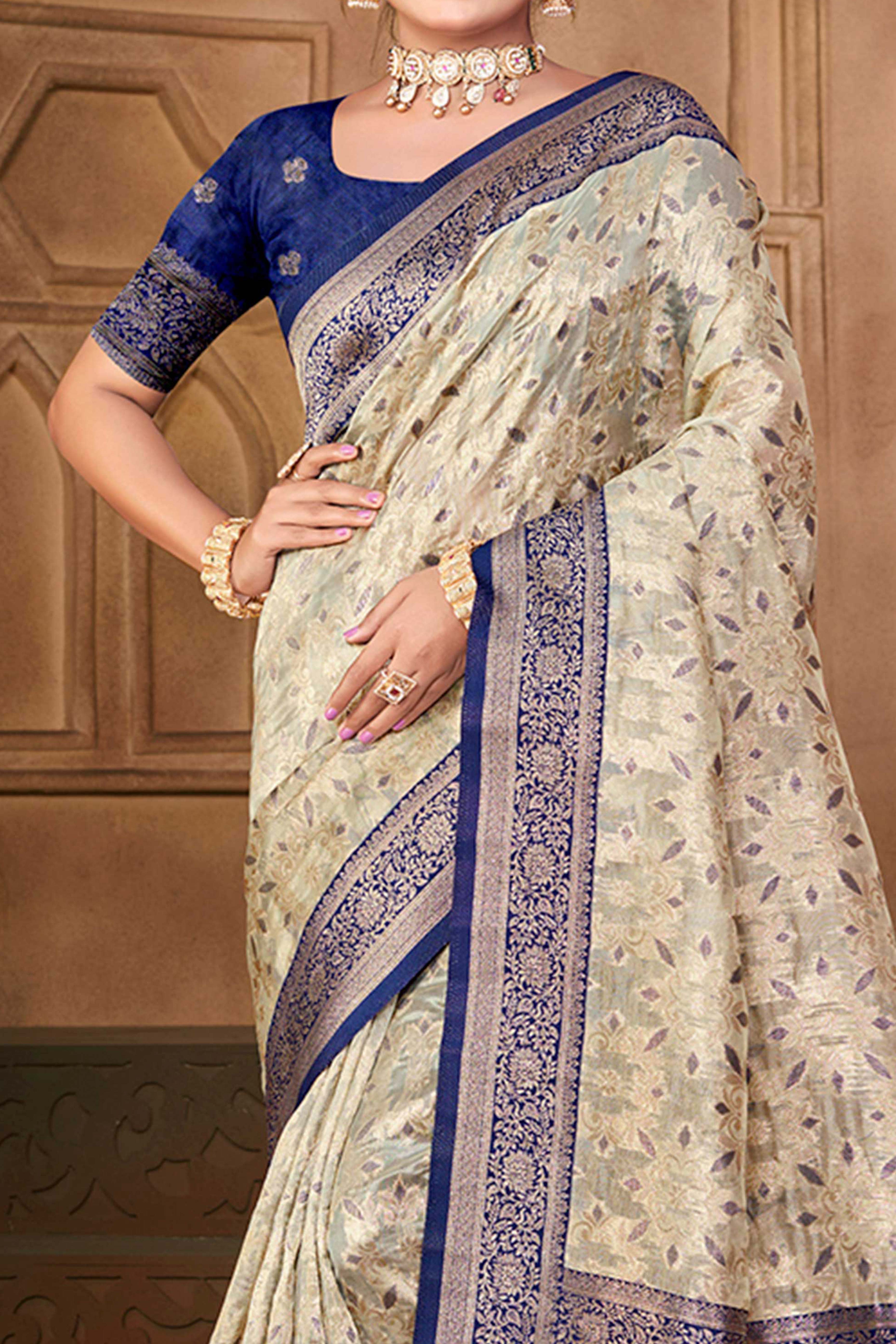 Stunning Beige & Navy Blue Floral Weaving Silk Blend Saree Enhanced With A Stylish Tassel Pallu