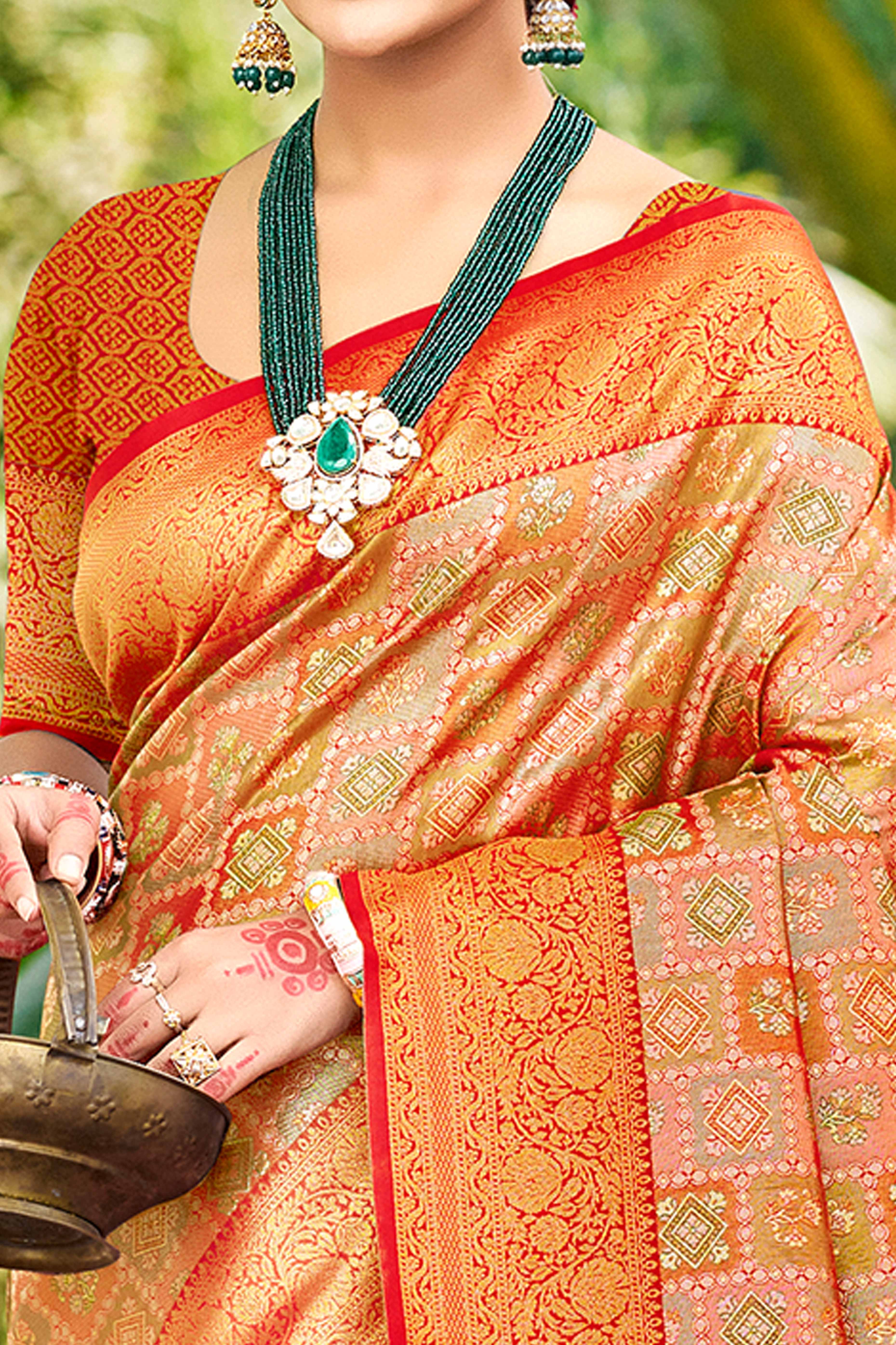 Orange Silk Blend Dharmavaram Saree Featuring Ornate Floral Weaves & Tassels Pallu