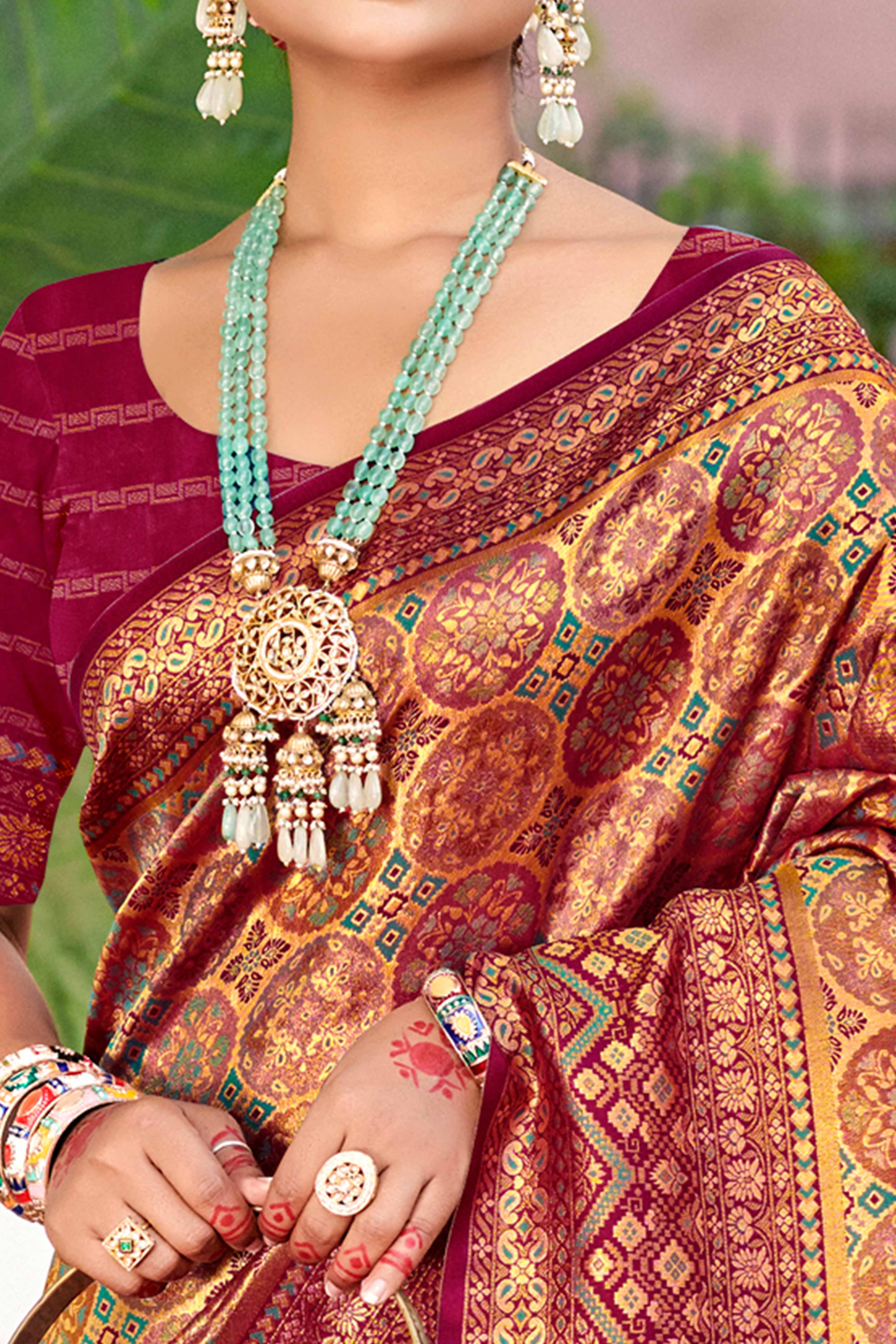 Floral Patterned Wine Woven Silk Blend Dharmavaram Saree With Tassel Elegance