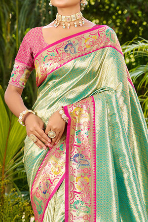 Graceful Turquoise Silk Blend Saree Adorned With Intricate Zari Weave & Peacock Motif Pallu