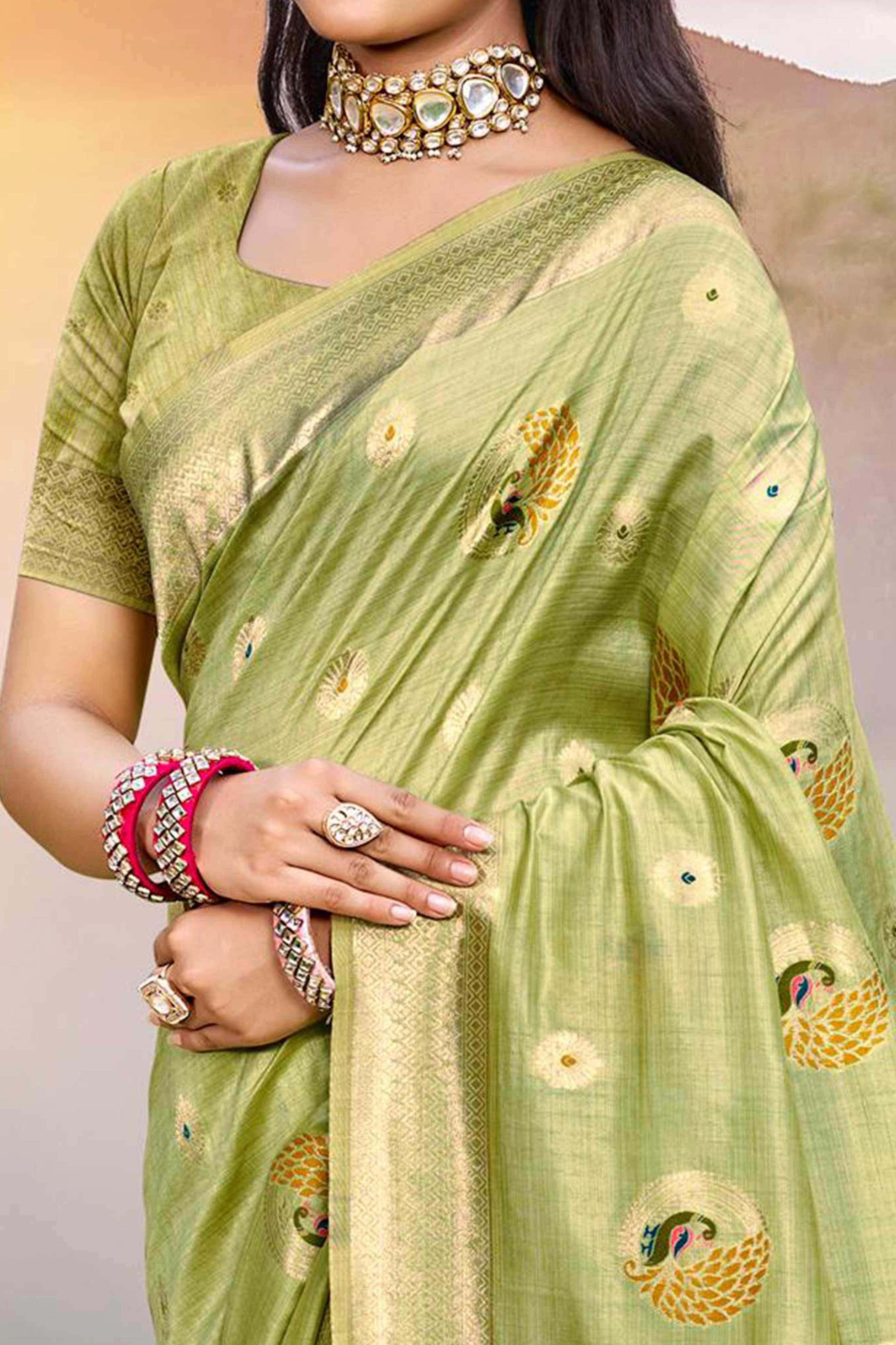 Designer Green Assam Silk Blend Saree Adorned With Peacock Zari Weaving & Tassel Pallu