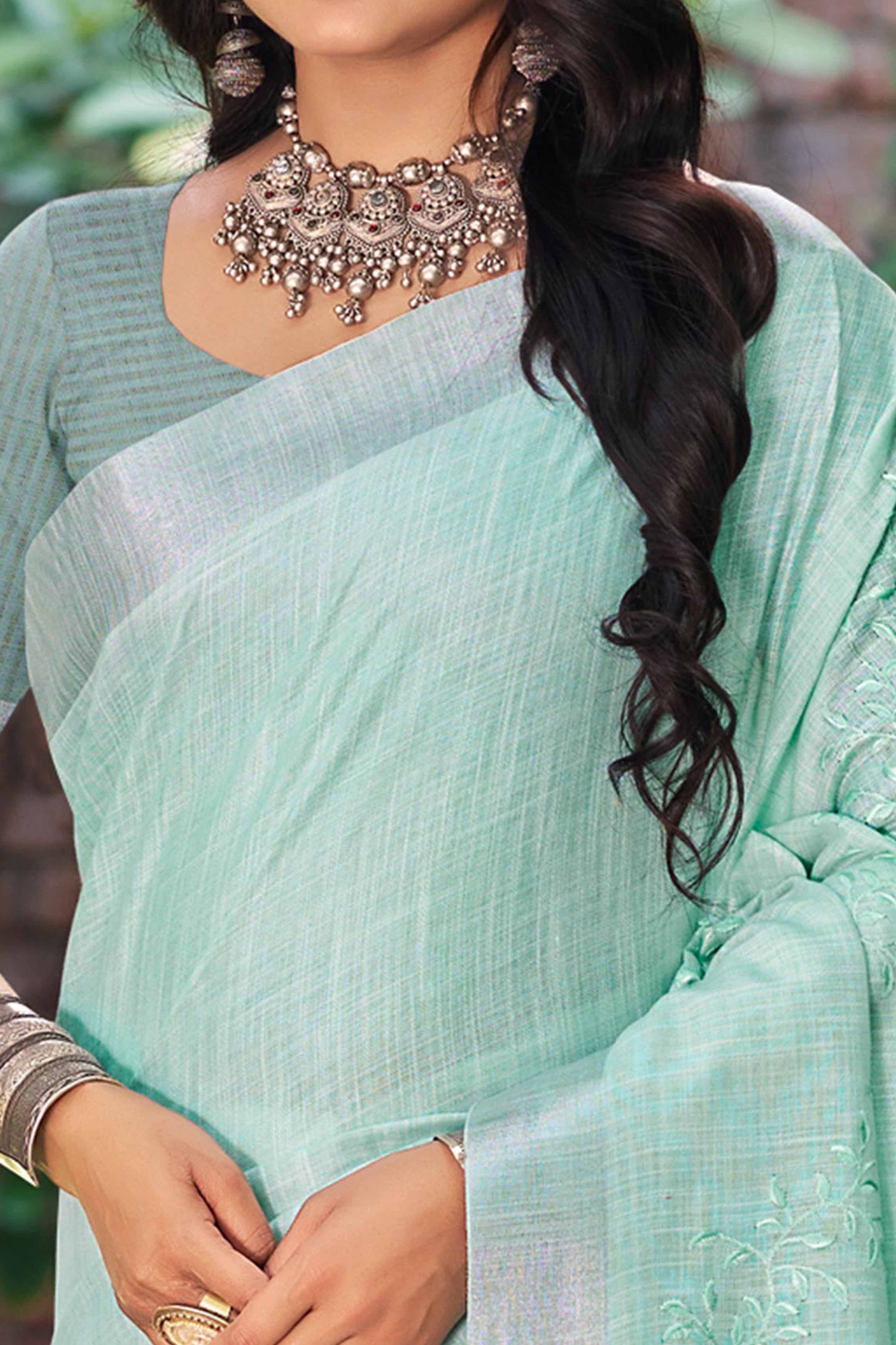 Elegant Sea Green Linen Saree Featuring Intricate Woven & Embroidered Patterns
