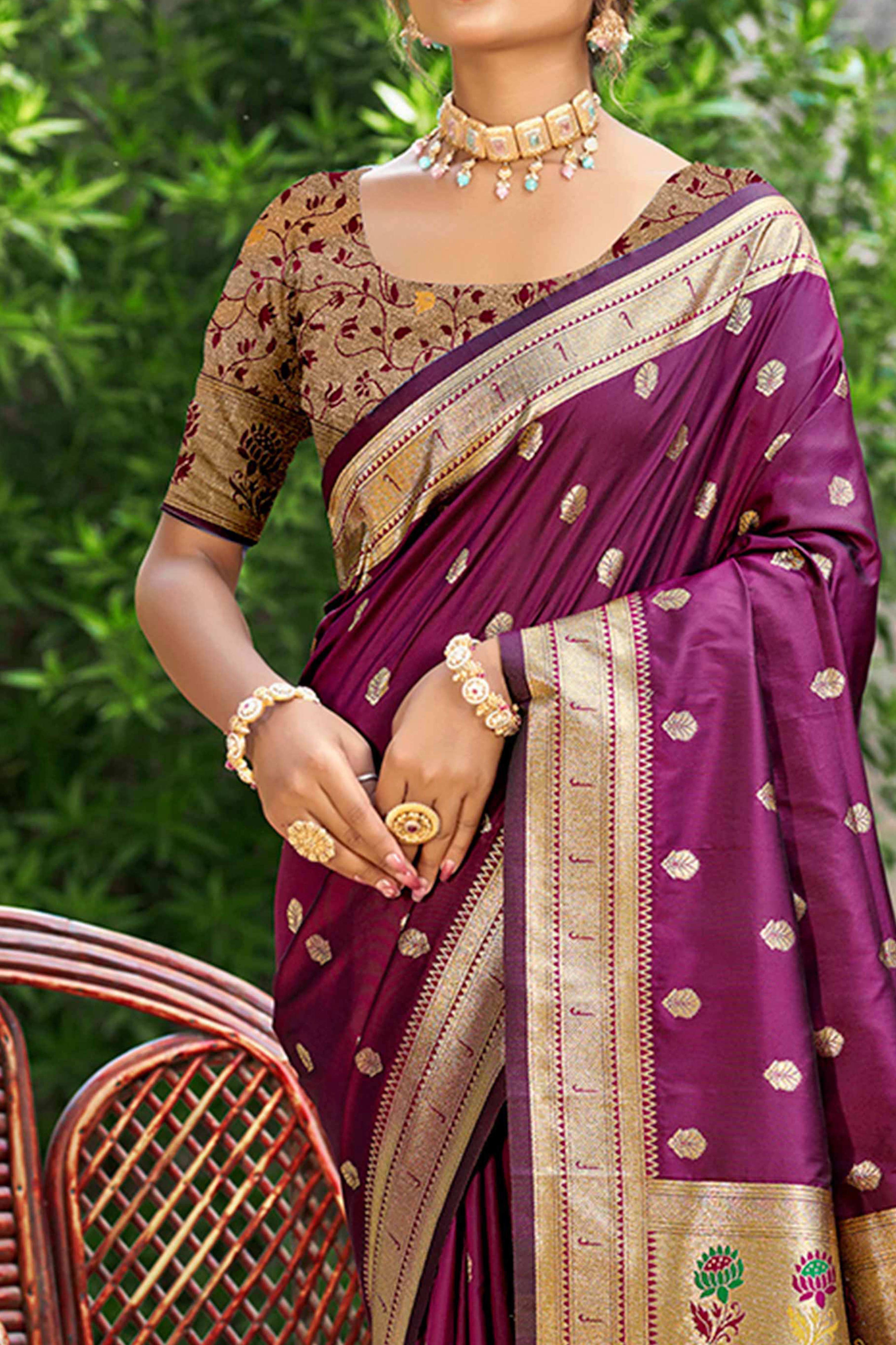 Wine Zari Weaving Silk Blend Saree Adorned With Intricate Peacock Motif Pallu & Graceful Tassel