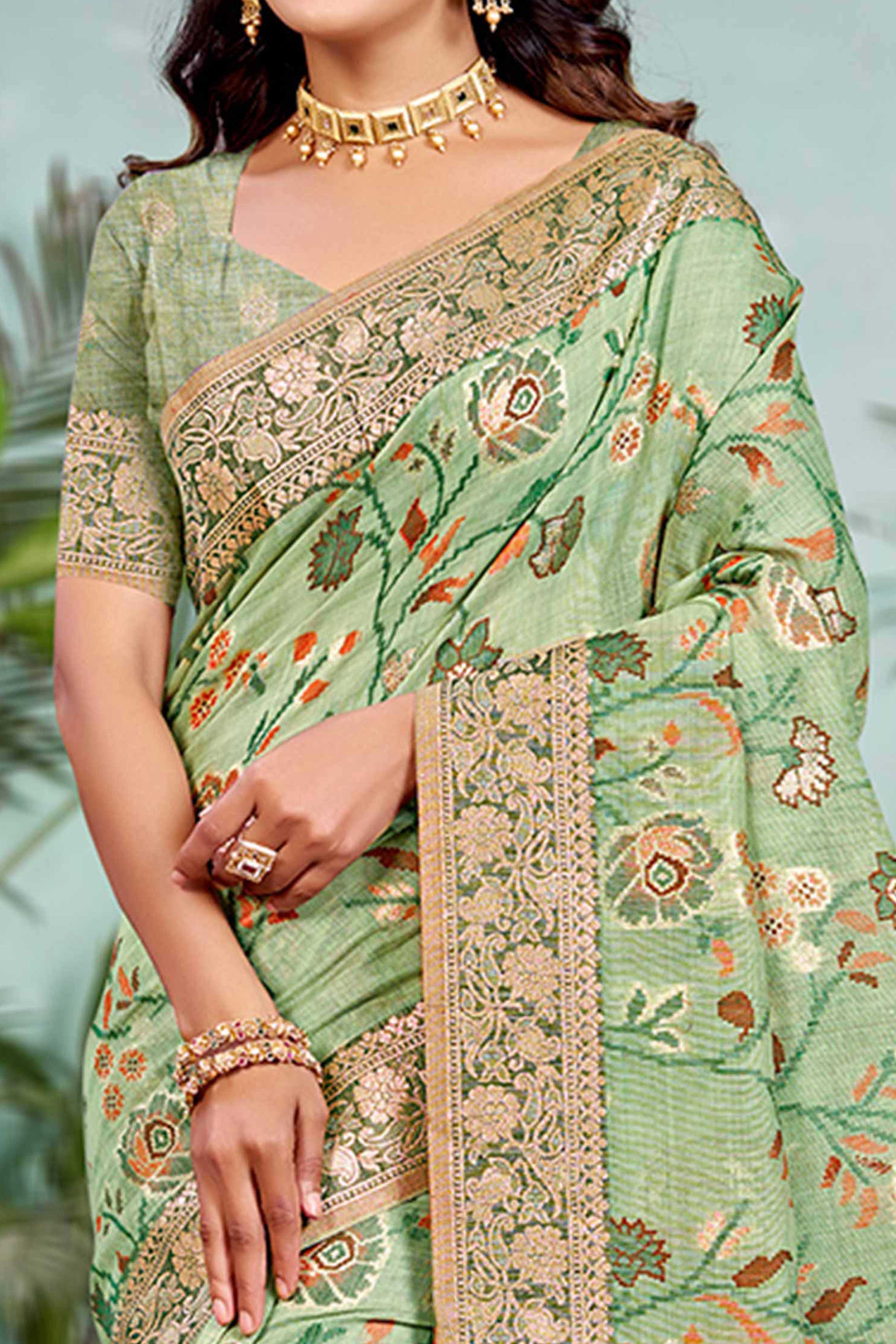 Captivating Green Floral Zari Weaving Cotton Silk Saree Accented With Tassel Pallu