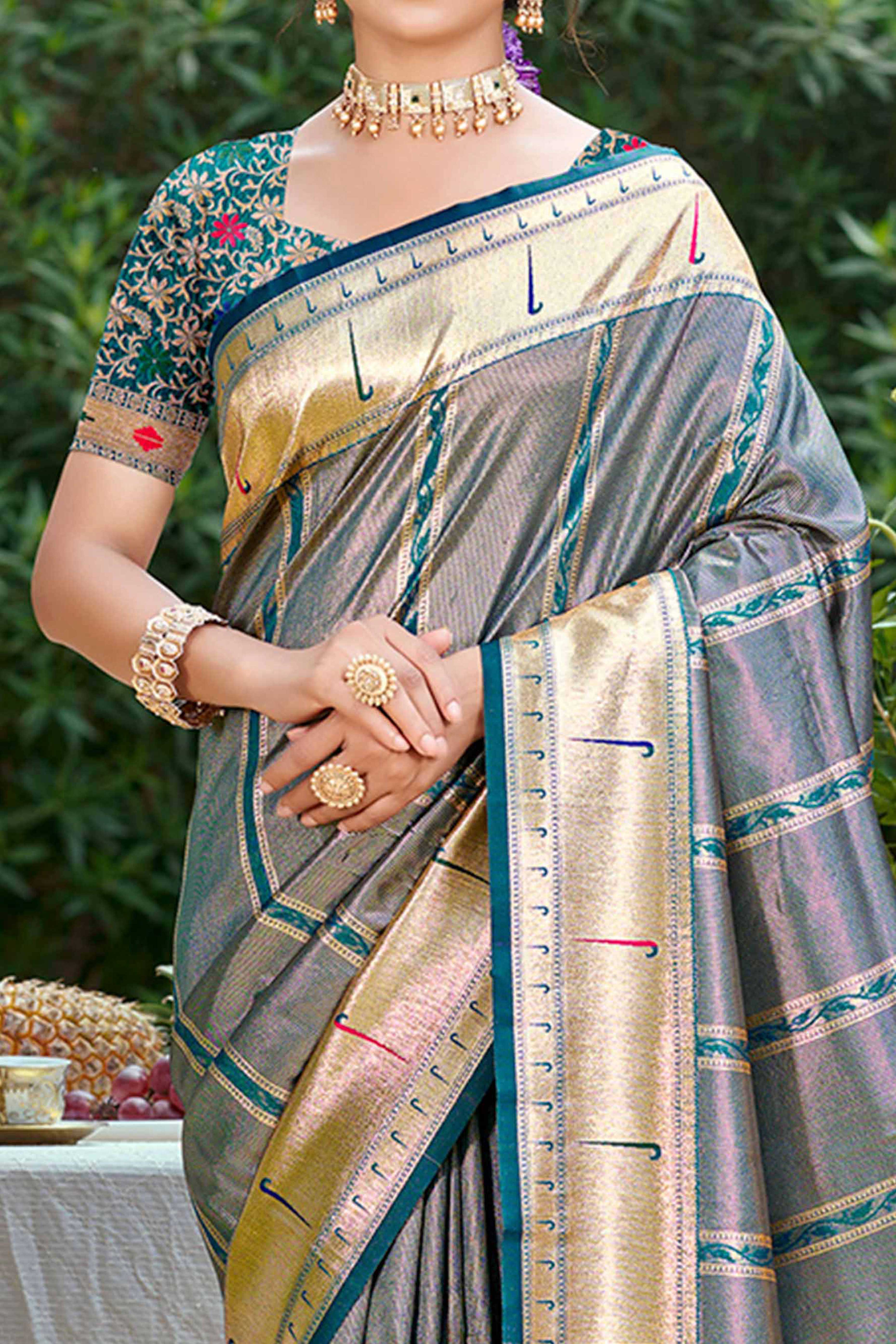 Teal Designer Weaving Silk Blend Saree Accented With Graceful Peacock & Floral Motif Pallu