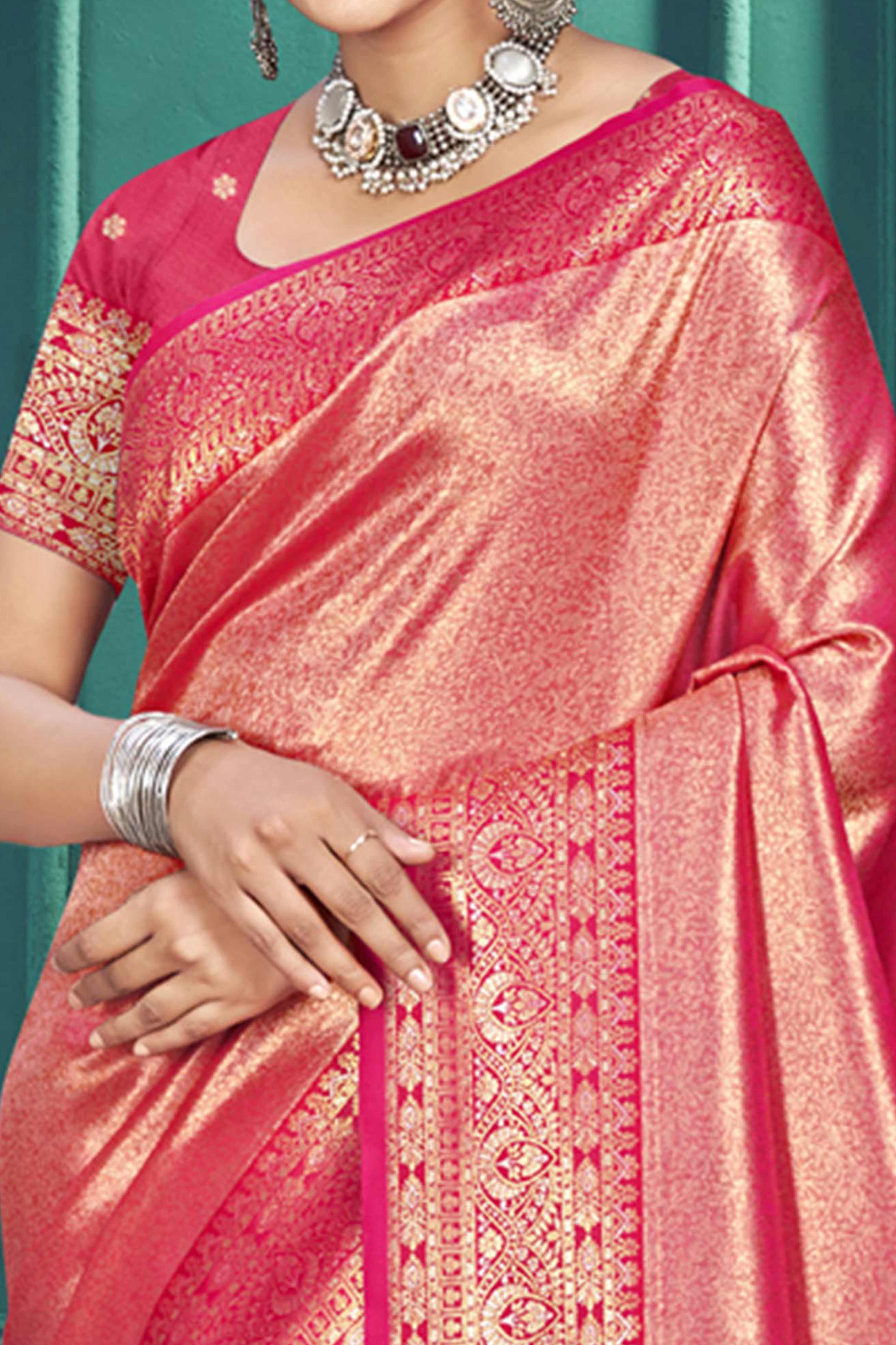 Exclusive Rani Pink Floral Motif Woven Kanjivaram Silk Saree With Graceful Tassel Pallu