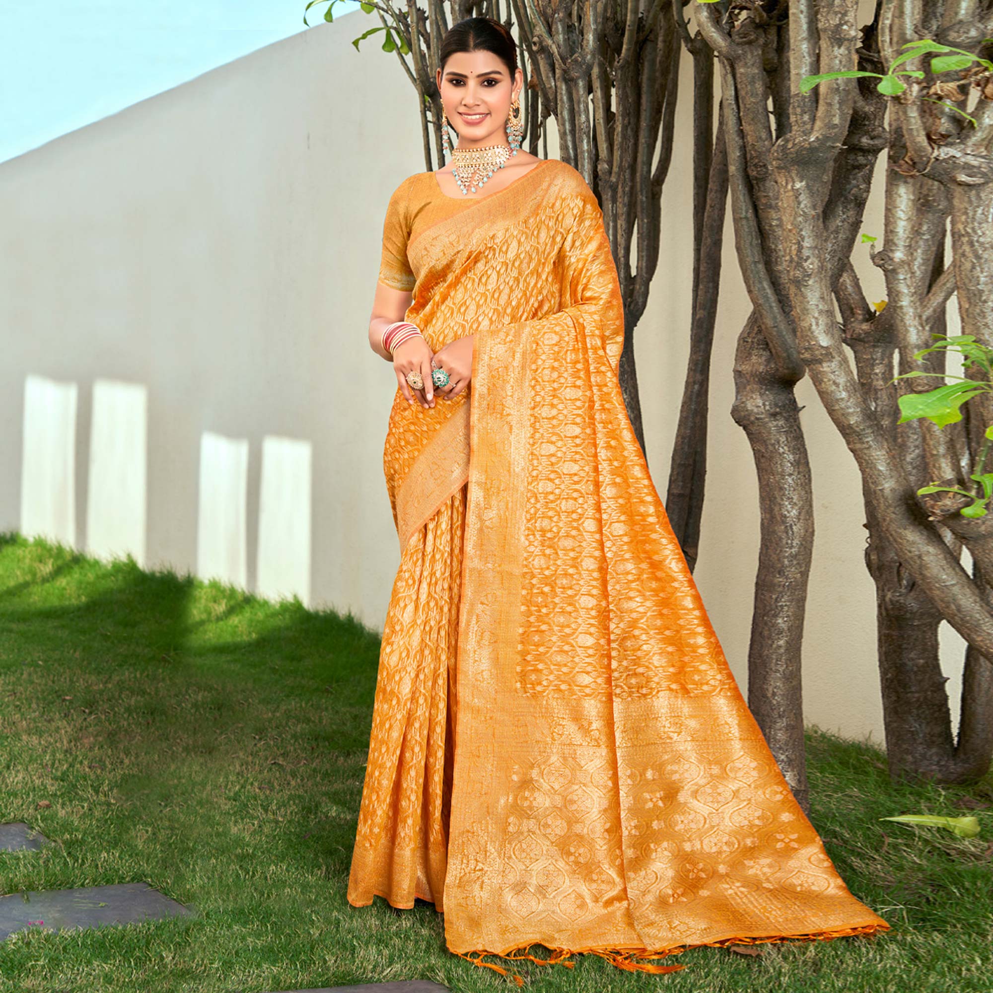 Mustard Floral Woven Cotton Blend Saree With Tassels