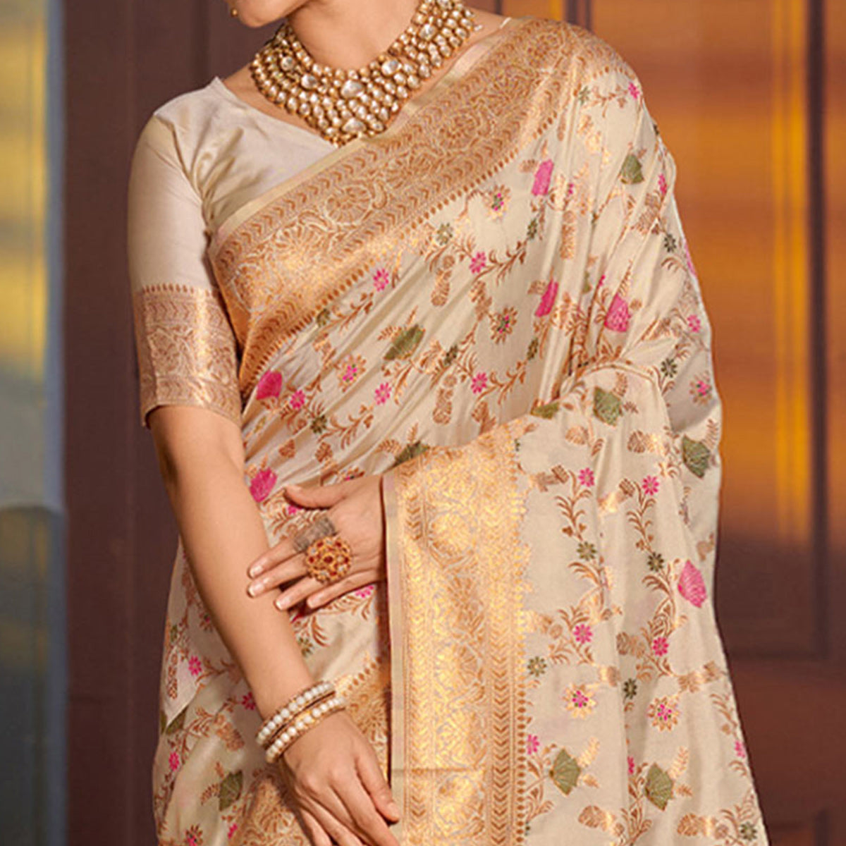 Cream Floral Woven Banarasi Silk Saree With Tassels