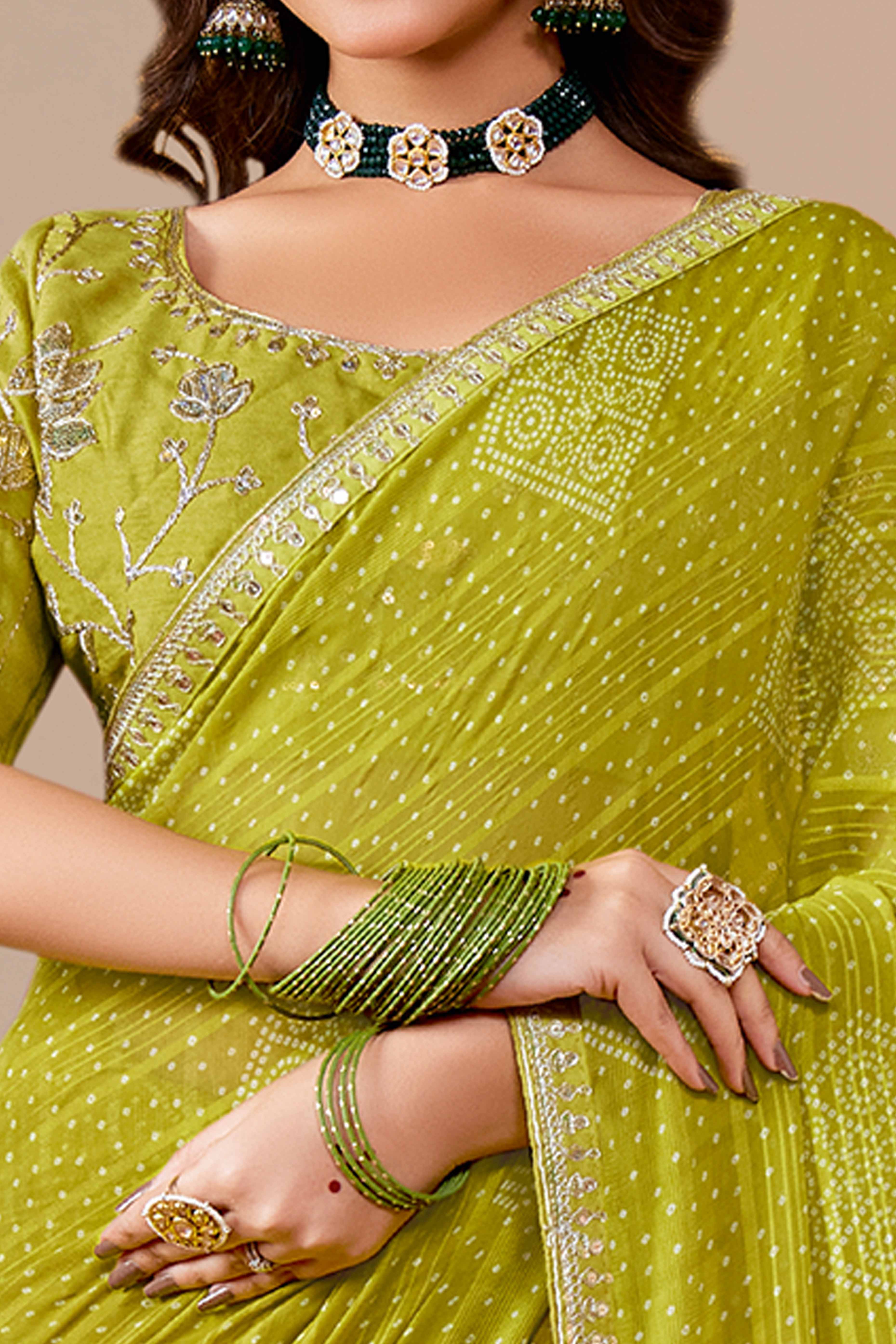 Green Bandhani Printed Georgette Saree Enhanced With Sequins & Cording Embroidered Lace Border